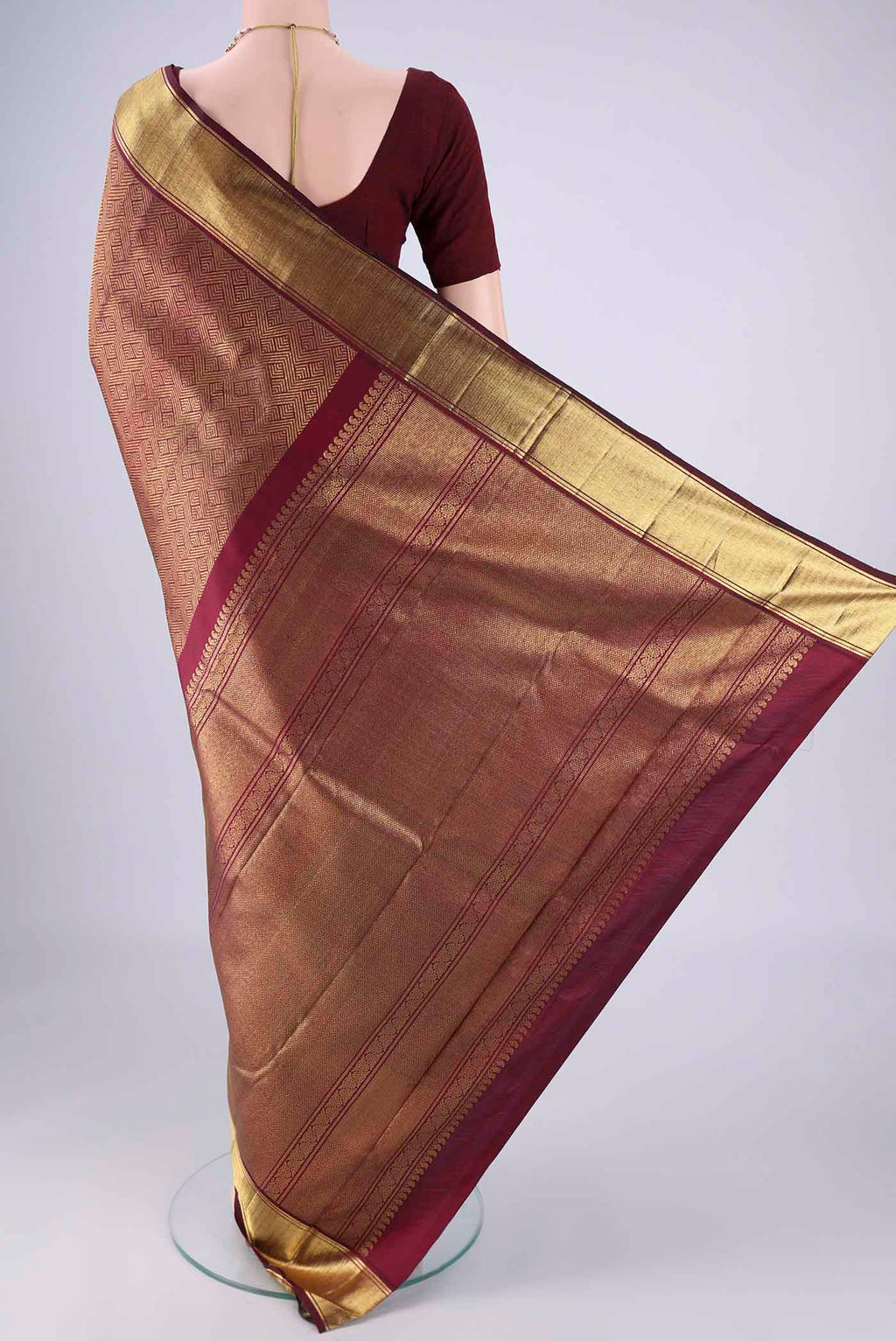 Flat view of Pure Silk Pure Zari Maroon Kanjivaram Saree with Zari Brocade on the body and Zari Border. 
