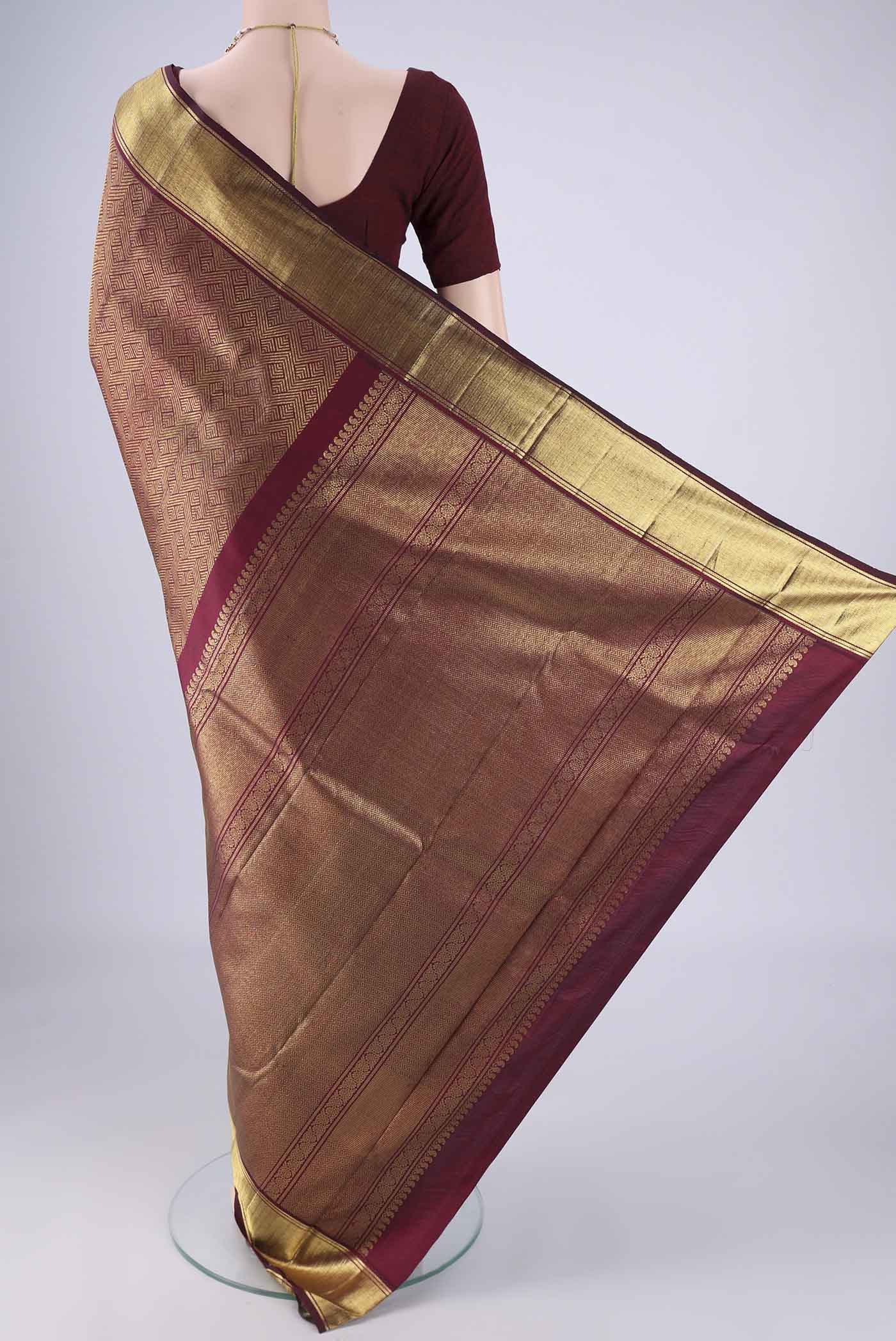 Flat view of Pure Silk Pure Zari Maroon Kanjivaram Saree with Zari Brocade on the body and Zari Border. 
