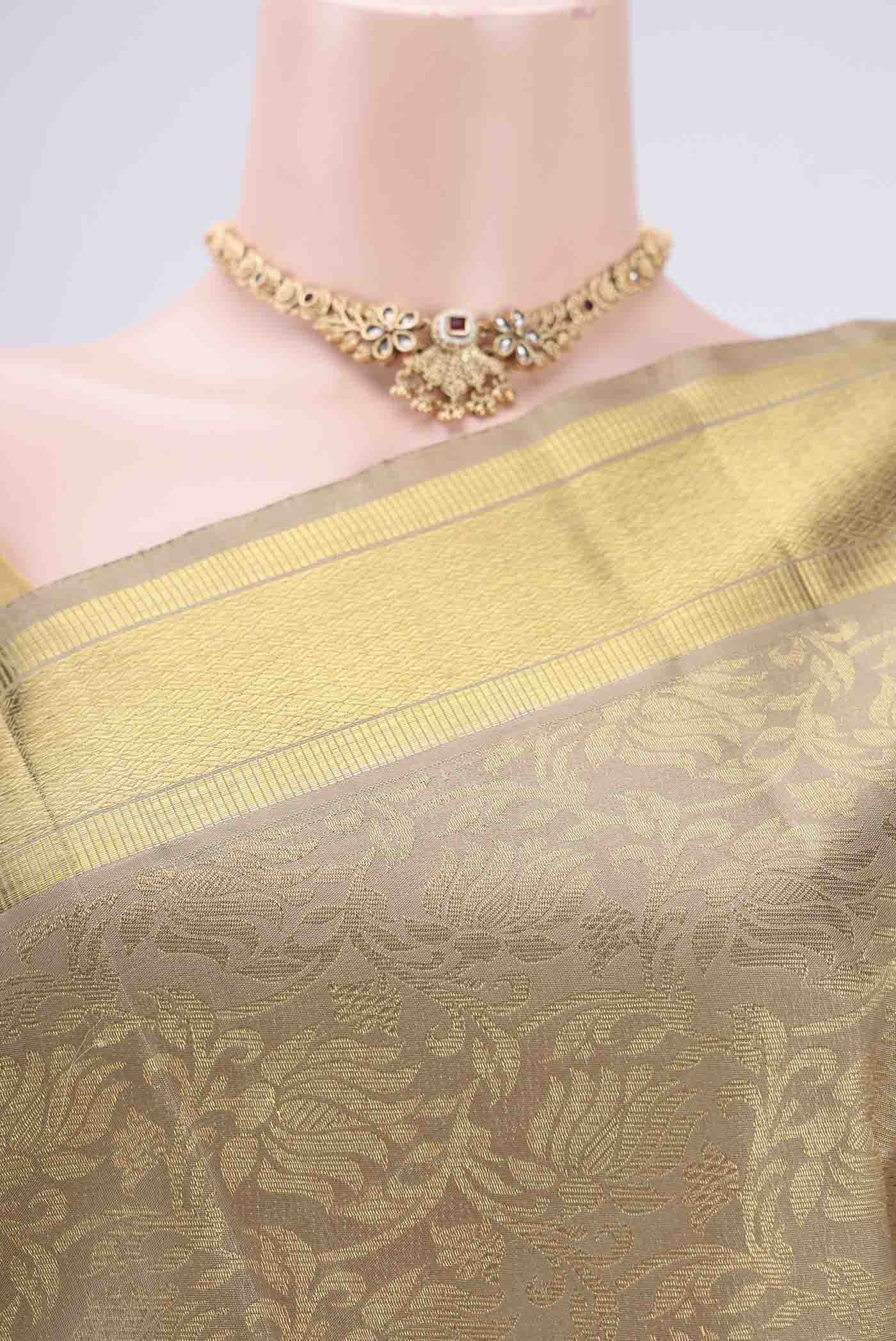 Border image of Pure Silk Pure Zari Beige Kanjivaram Saree with Zari Butta on the body and Zari Border. 
