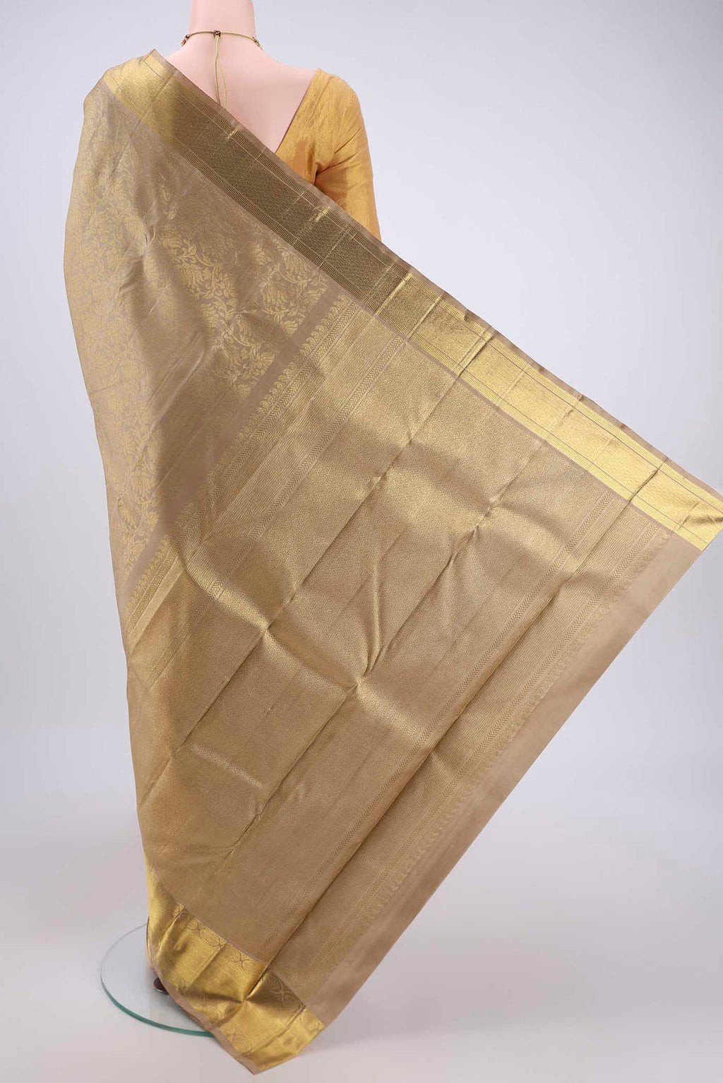 Flat view of Pure Silk Pure Zari Beige Kanjivaram Saree with Zari Butta on the body and Zari Border. 