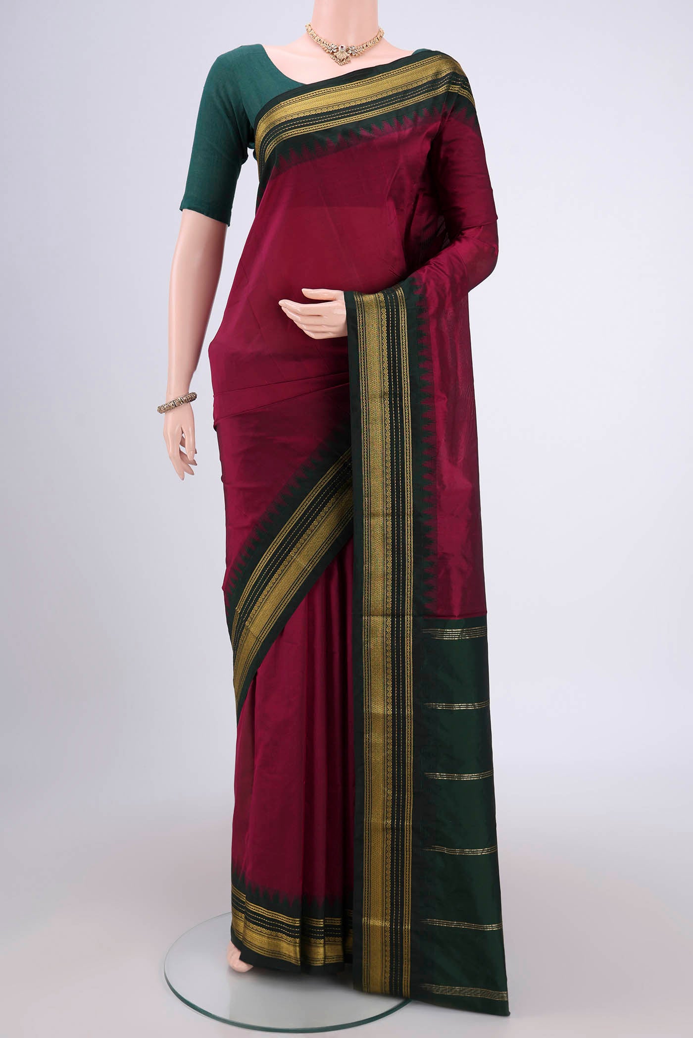 Magenta Blended Bangalore Silk Saree with Plain Body and Temple Border.  displayed on a mannequin