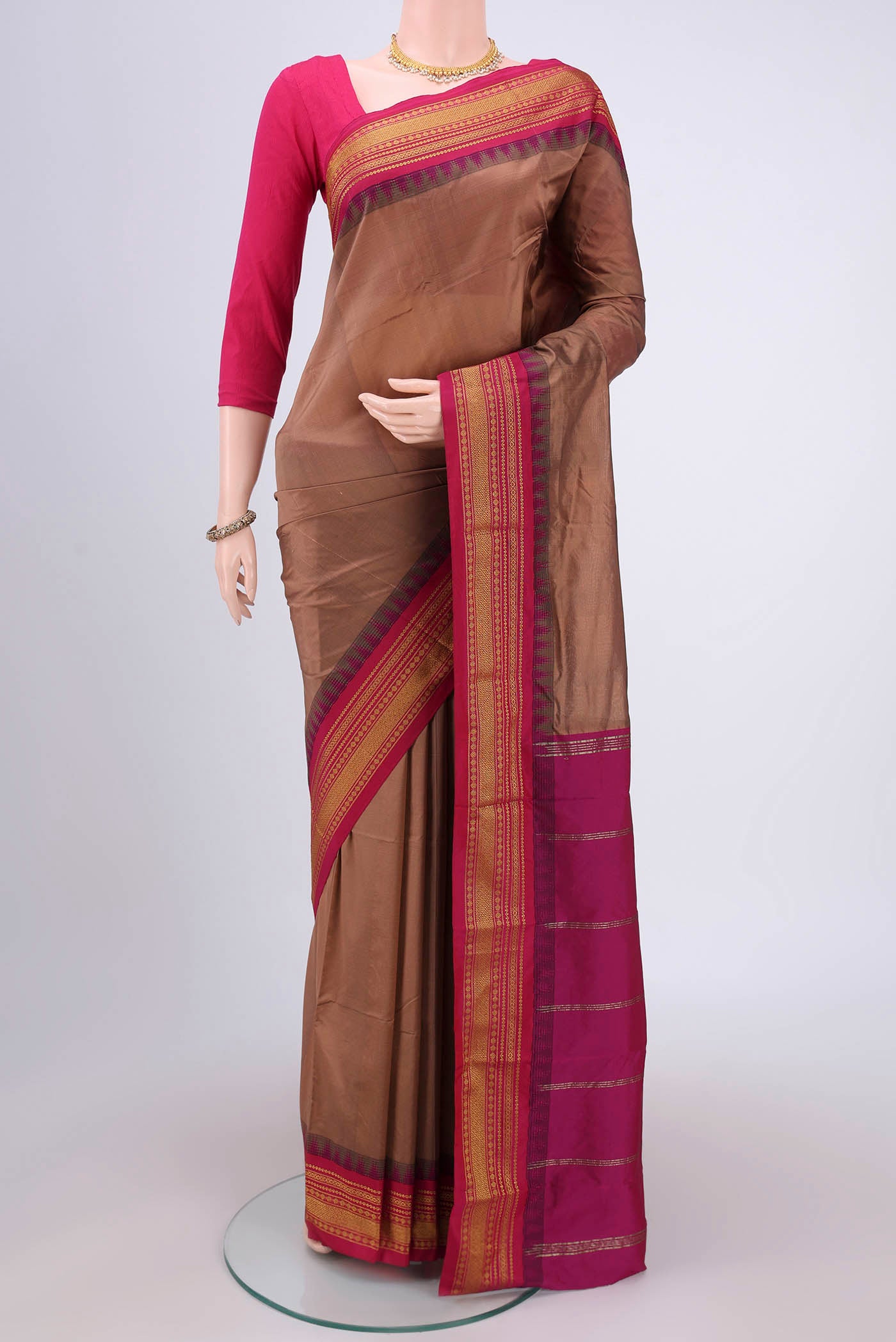 Coral Blended Bangalore Silk Saree with Plain Body and Temple Border.  displayed on a mannequin