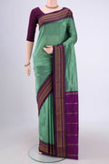 Pista Green Blended Bangalore Silk Saree with Plain Body and Temple Border.  displayed on a mannequin