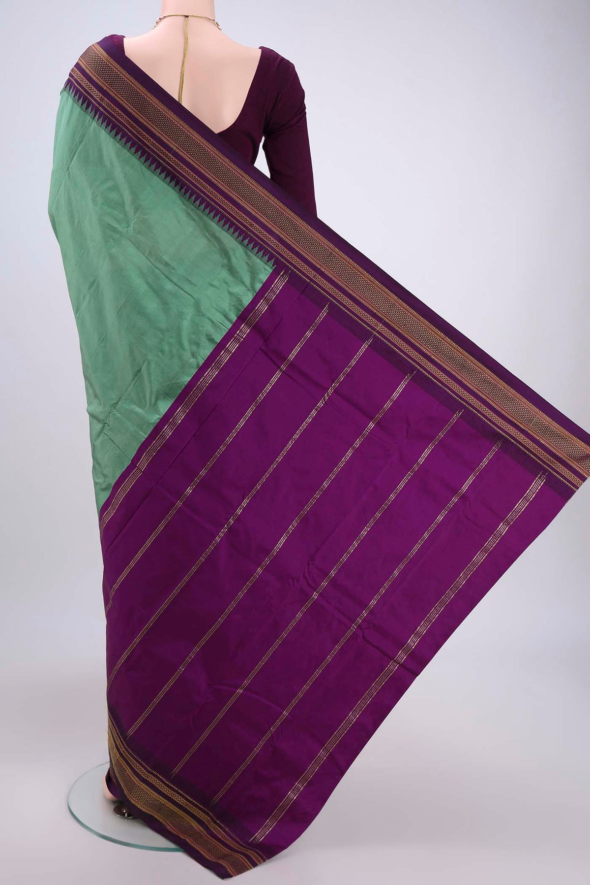 Flat view of Pista Green Blended Bangalore Silk Saree with Plain Body and Temple Border. 
