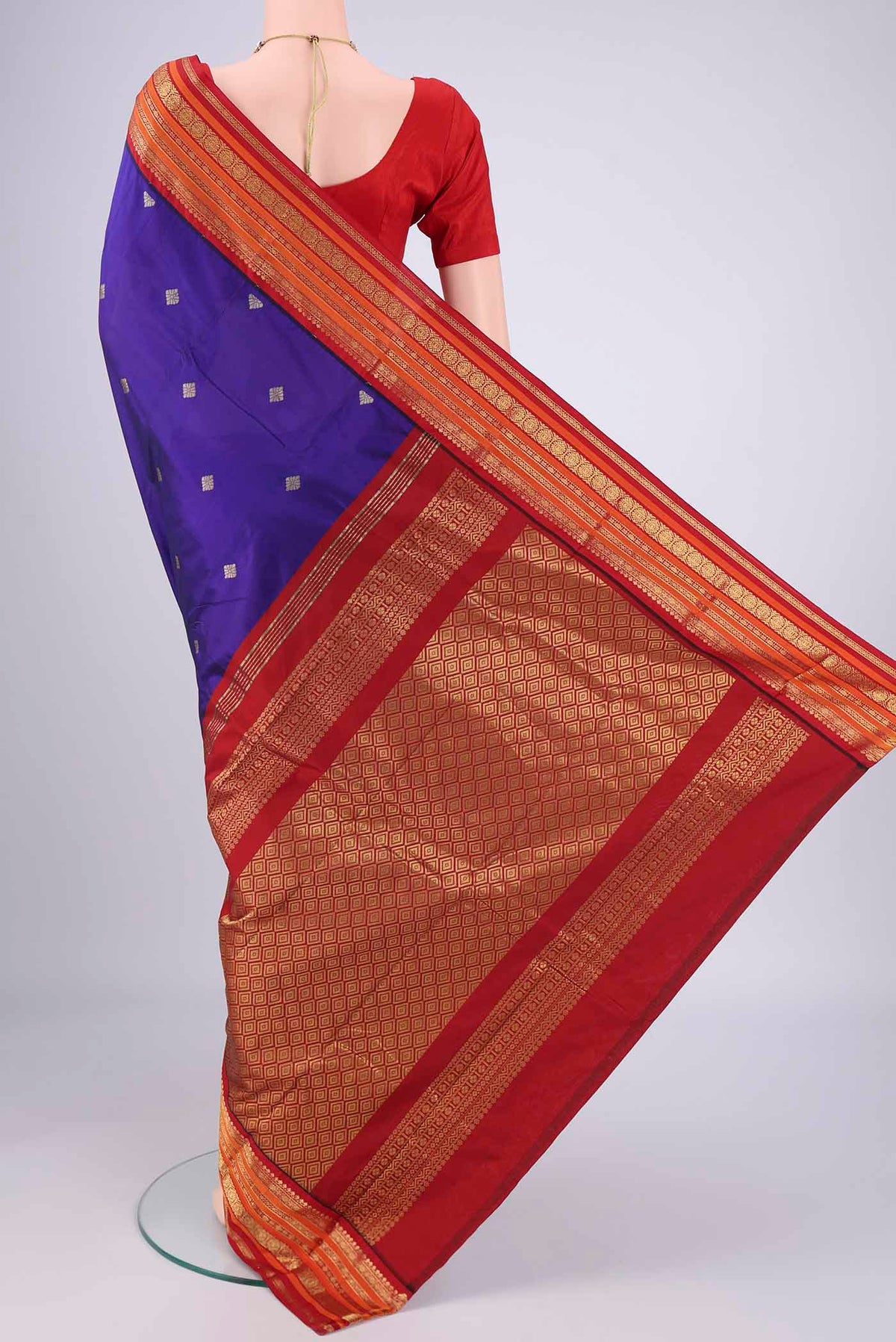 Flat view of Purple Blended Bangalore Silk Saree with Zari Butta on the body and Zari Border. 