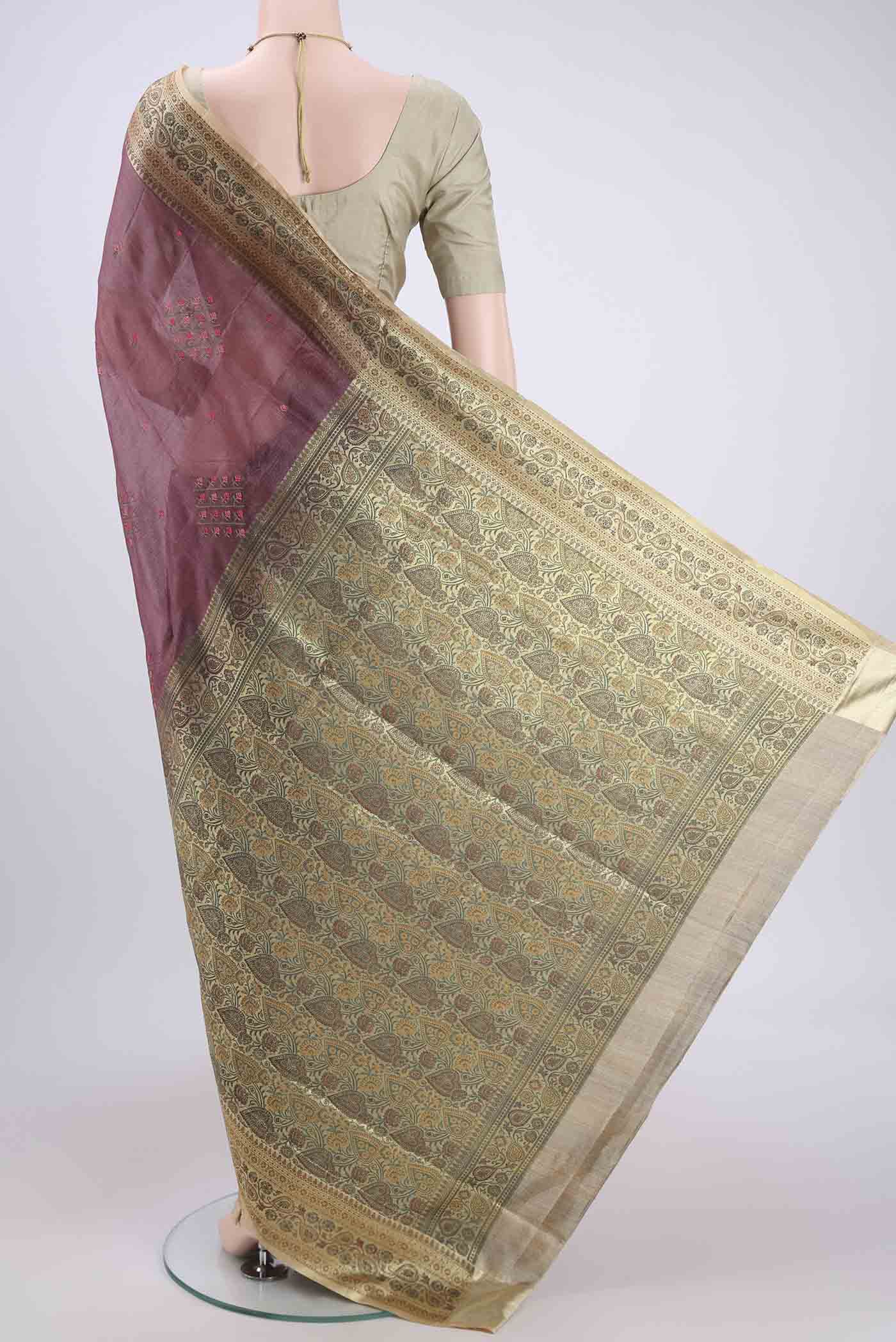 Flat view of Mauve Banarasi Tussar Silk Saree with Embroidery on the body and Zari And Thread Border. 