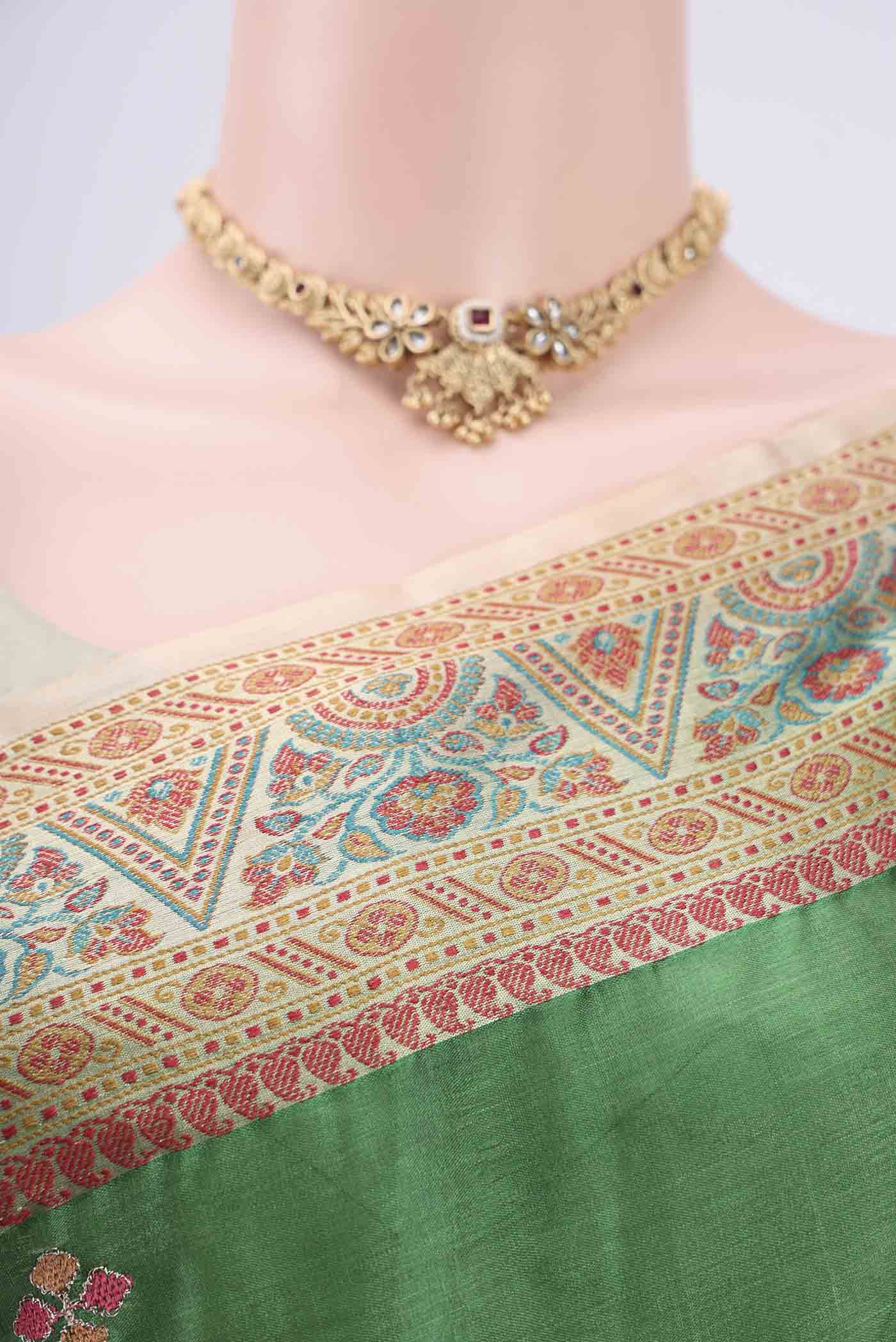 Border image of Green Banarasi Tussar Silk Saree with Embroidery on the body and Zari And Thread Border. 