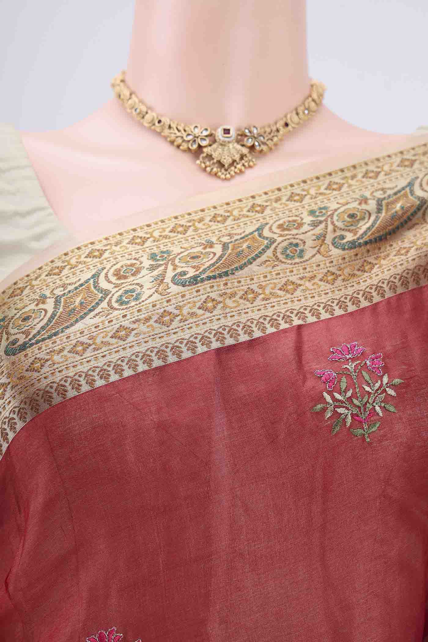 Border image of Maroon Banarasi Tussar Silk Saree with Embroidery on the body and Zari And Thread Border. 