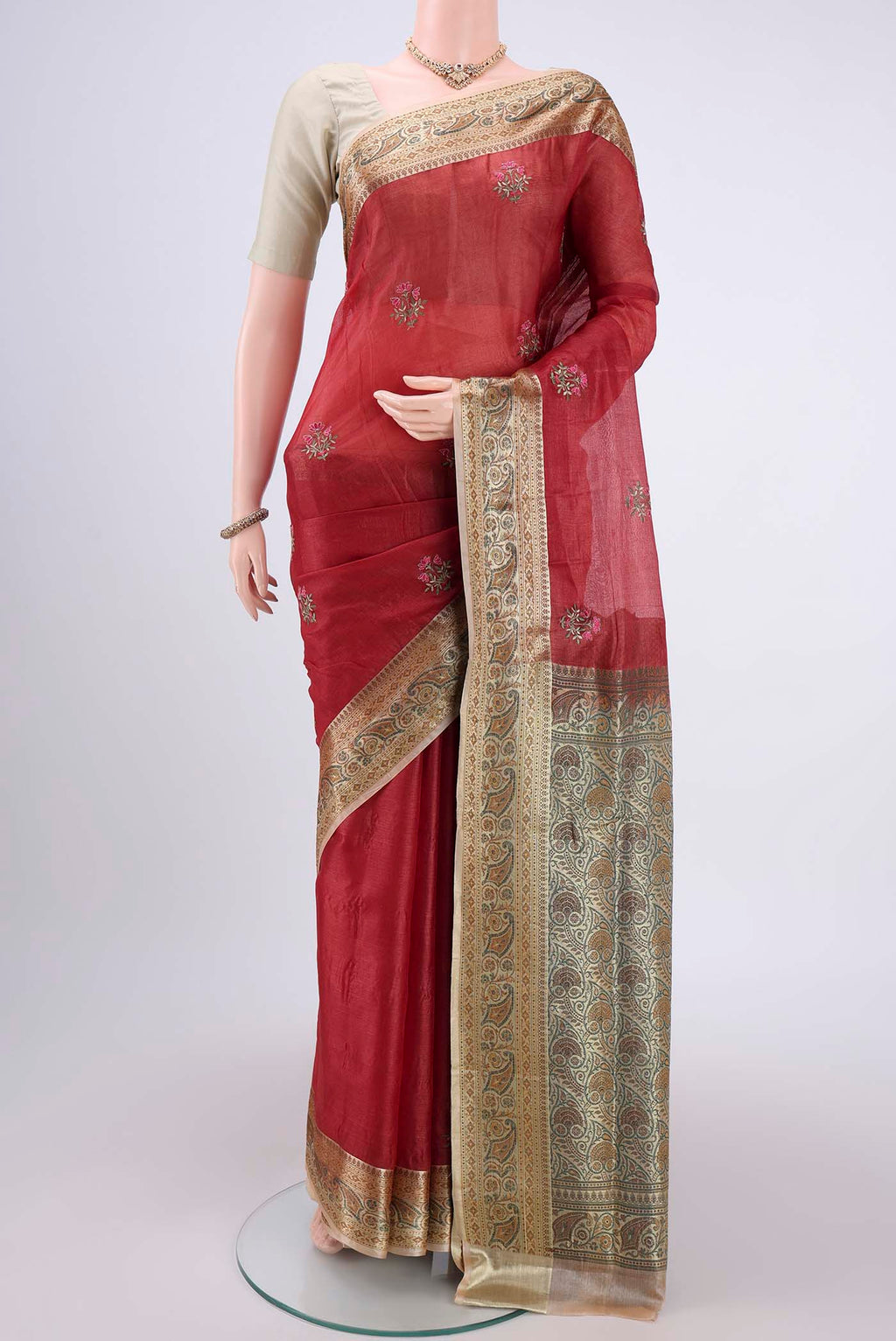 Maroon Banarasi Tussar Silk Saree with Embroidery on the body and Zari And Thread Border.  displayed on a mannequin