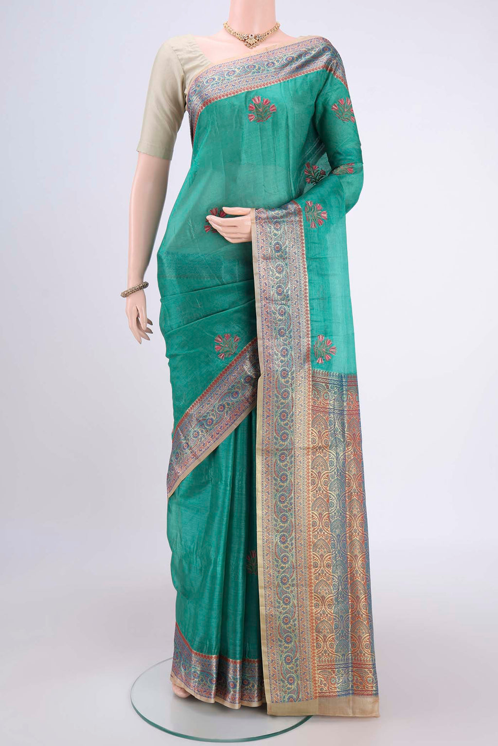 Sea Green Dual Tone Maheshwari Silk Cotton Saree with Stripes on the body and Zari Border.  displayed on a mannequin