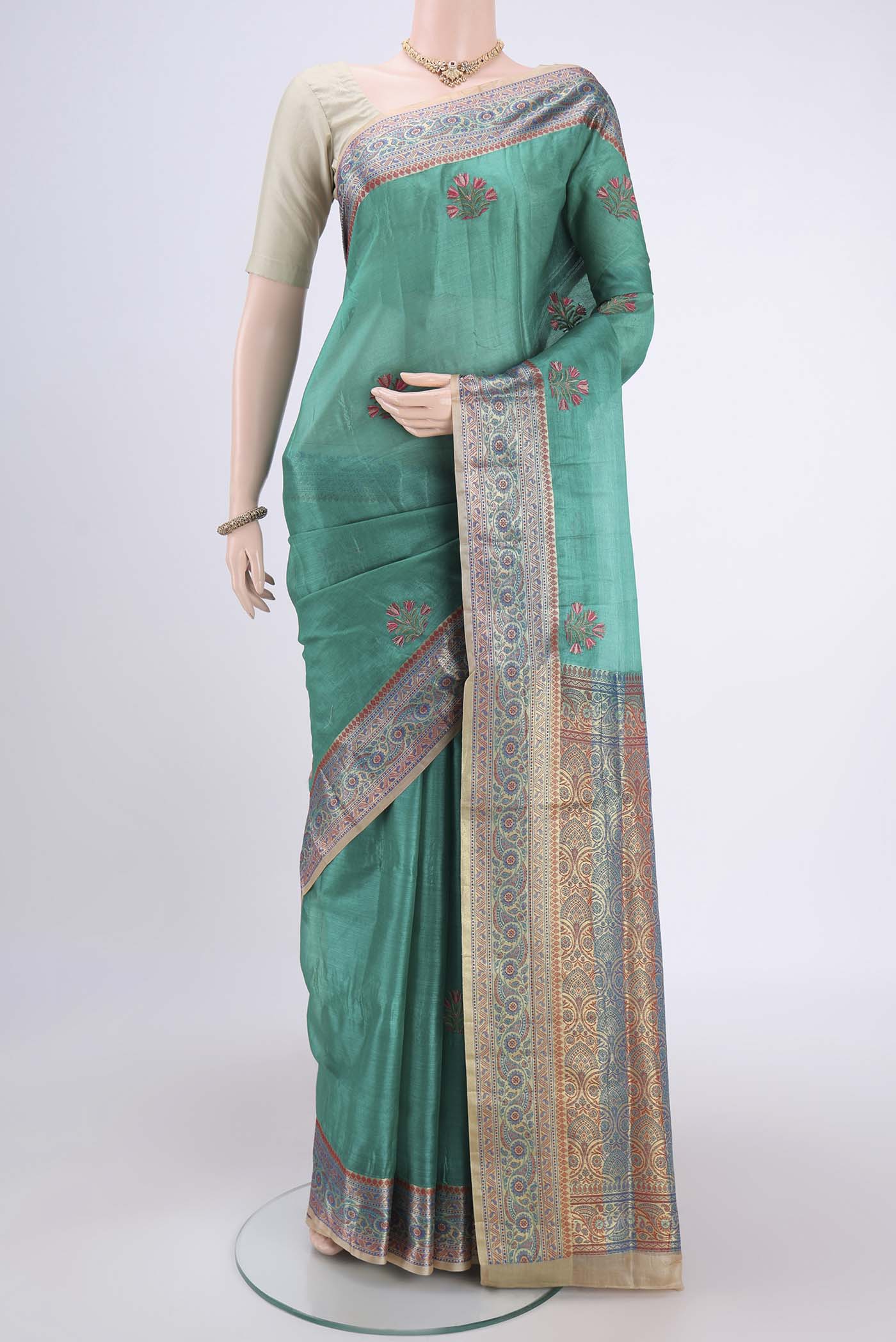 Sea Green Dual Tone Maheshwari Silk Cotton Saree with Stripes on the body and Zari Border.  displayed on a mannequin