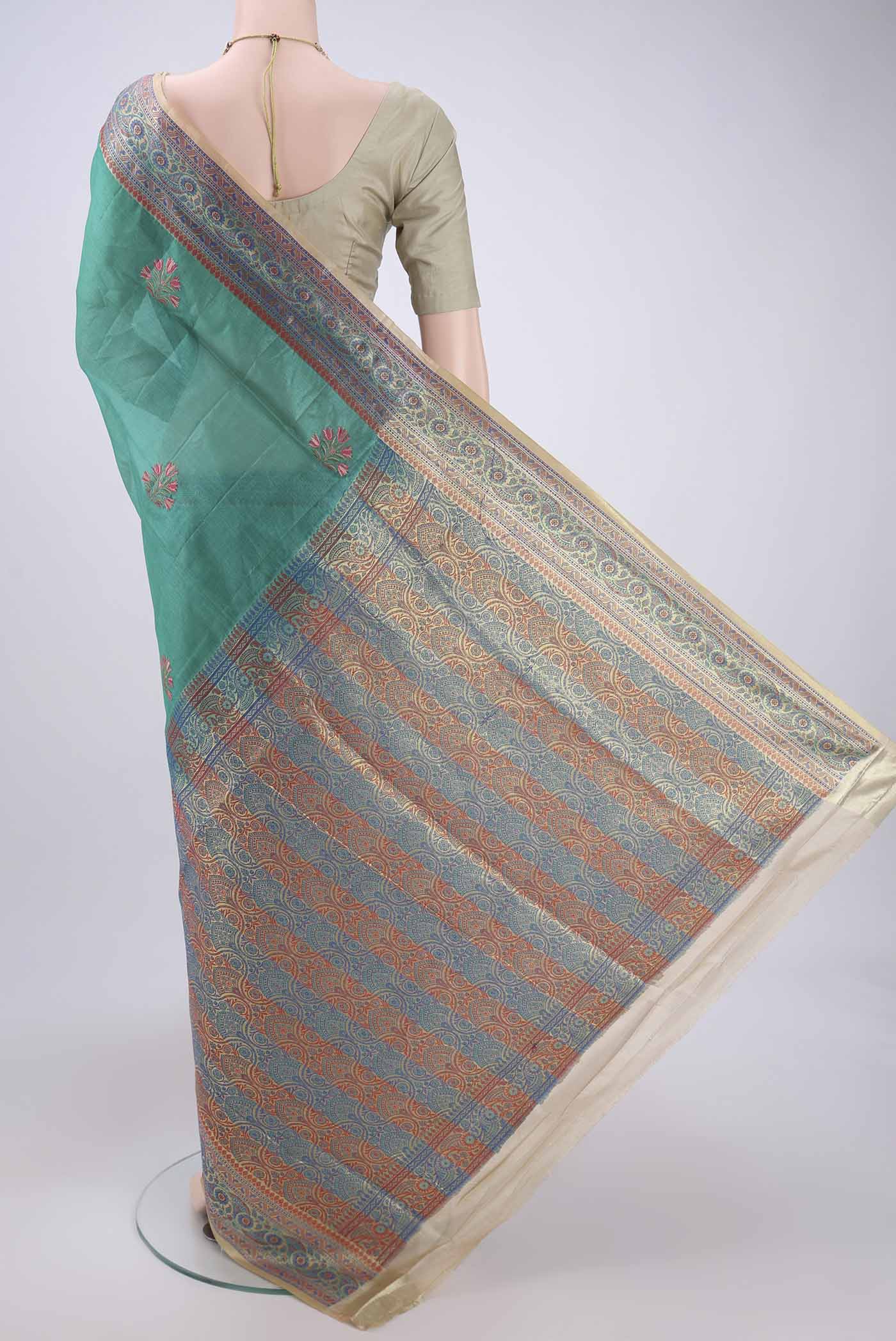 Flat view of Sea Green Dual Tone Maheshwari Silk Cotton Saree with Stripes on the body and Zari Border. 