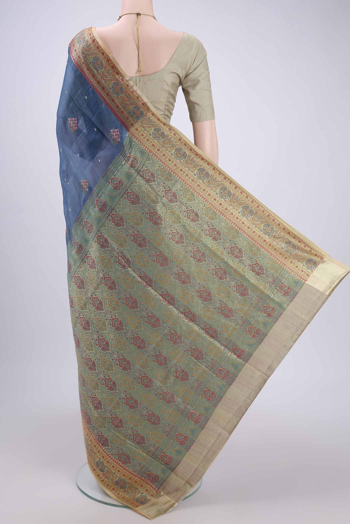 Flat view of Electric Blue Banarasi Tussar Silk Saree with Embroidery on the body and Zari And Thread Border. 