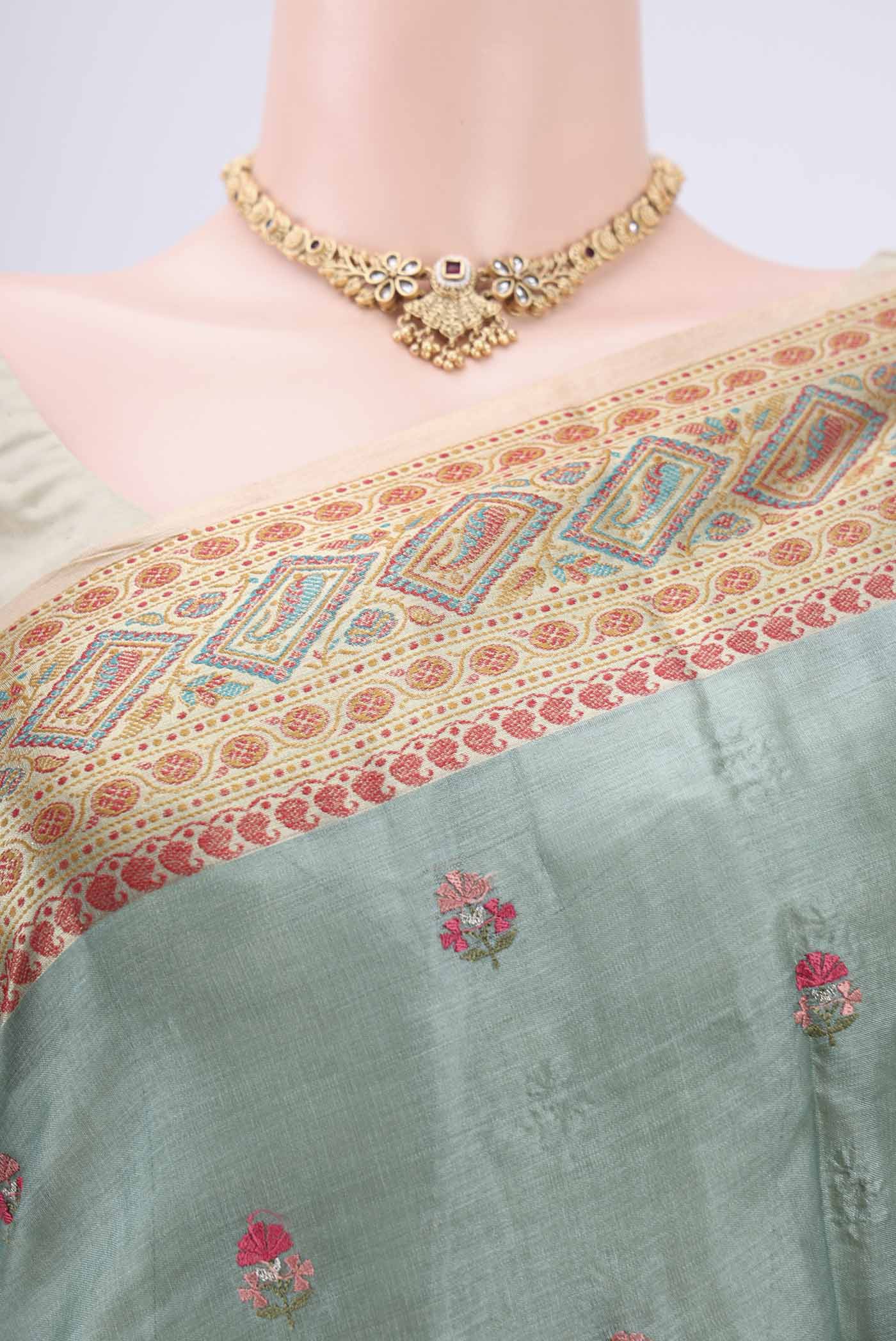 Border image of Light Green Banarasi Tussar Silk Saree with Embroidery on the body and Zari And Thread Border. 