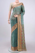 Light Green Banarasi Tussar Silk Saree with Embroidery on the body and Zari And Thread Border.  displayed on a mannequin