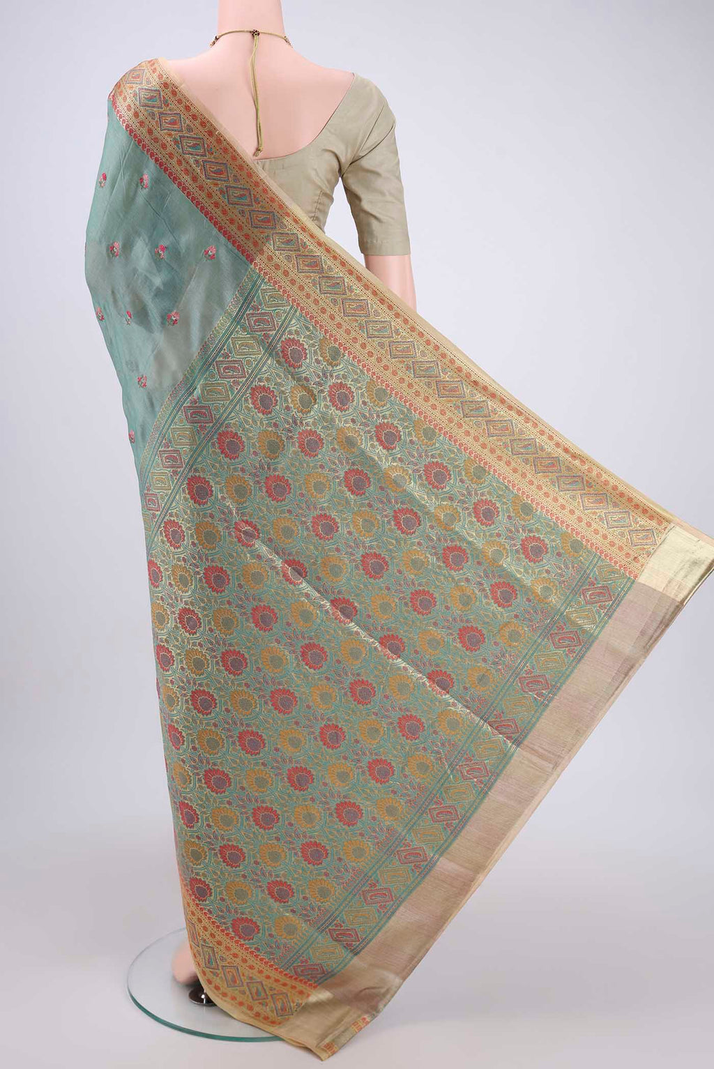 Flat view of Light Green Banarasi Tussar Silk Saree with Embroidery on the body and Zari And Thread Border. 