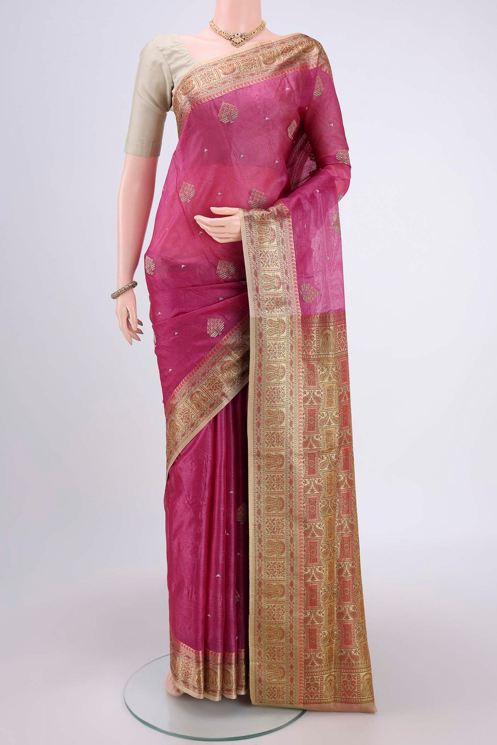 Magenta Banarasi Tussar Silk Saree with Embroidery on the body and Zari And Thread Border.  displayed on a mannequin