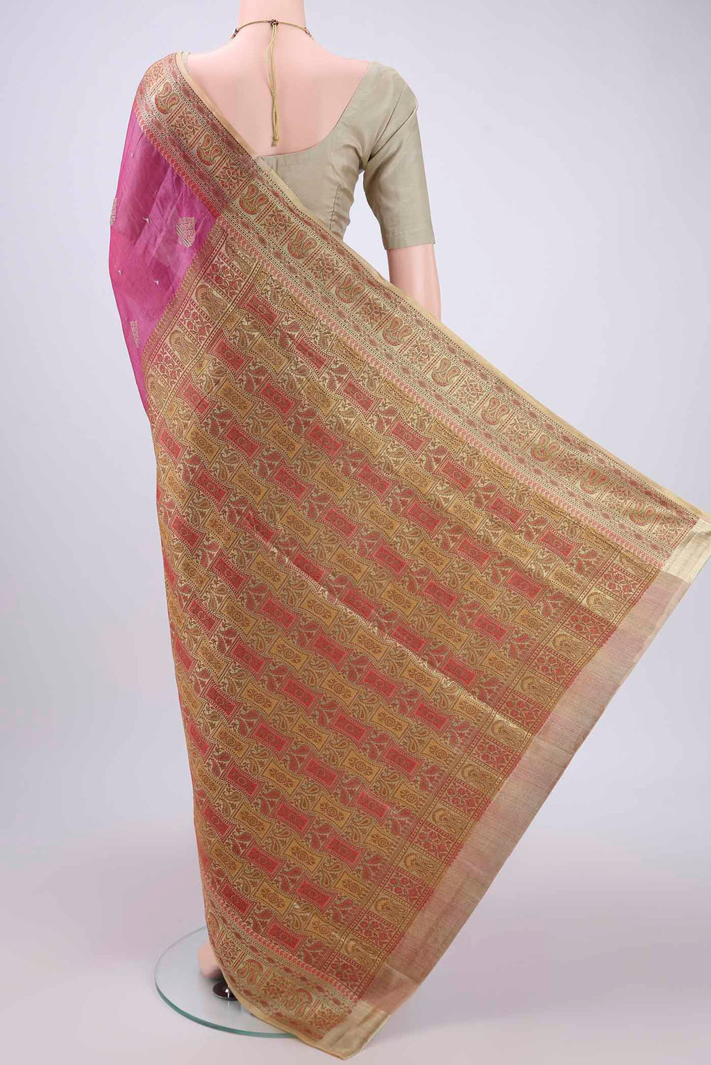 Flat view of Magenta Banarasi Tussar Silk Saree with Embroidery on the body and Zari And Thread Border. 