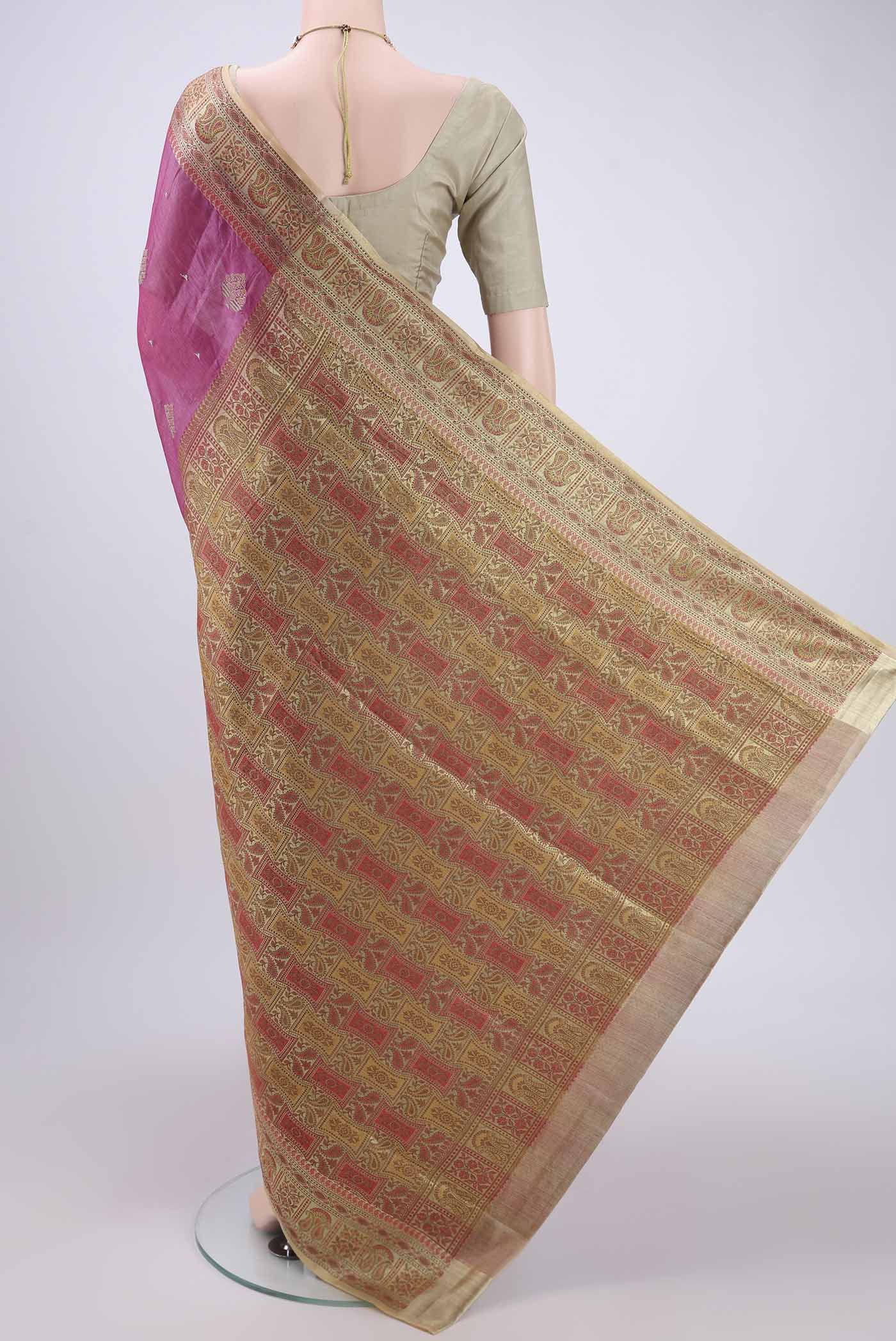 Flat view of Magenta Banarasi Tussar Silk Saree with Embroidery on the body and Zari And Thread Border. 