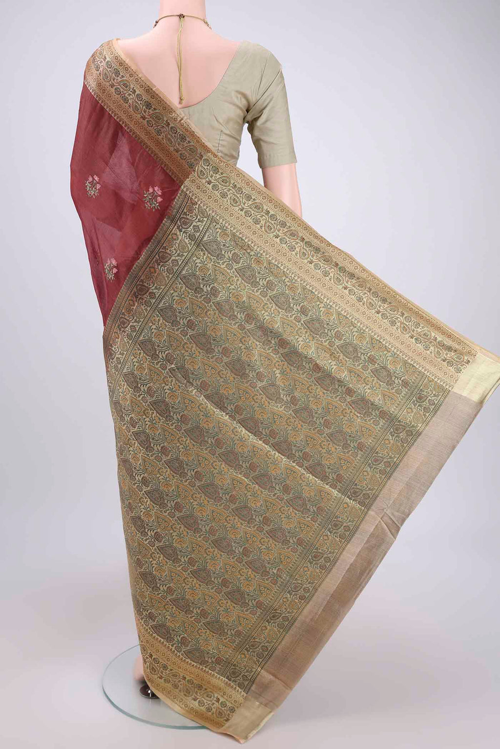 Flat view of Brown Banarasi Tussar Silk Saree with Embroidery on the body and Zari And Thread Border. 
