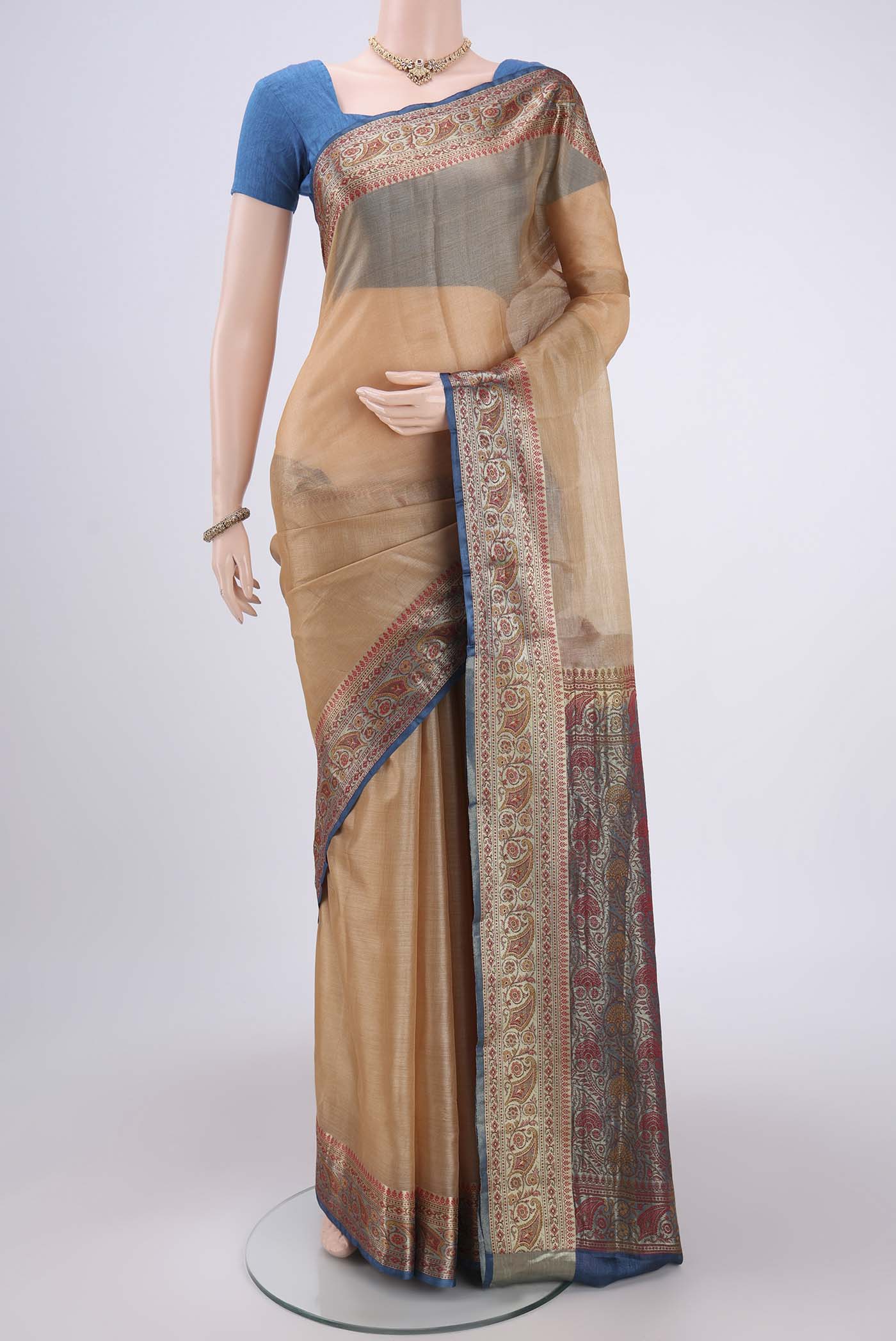 Beige Dual Tone Maheshwari Silk Cotton Saree with Plain Body and Zari Border.  displayed on a mannequin