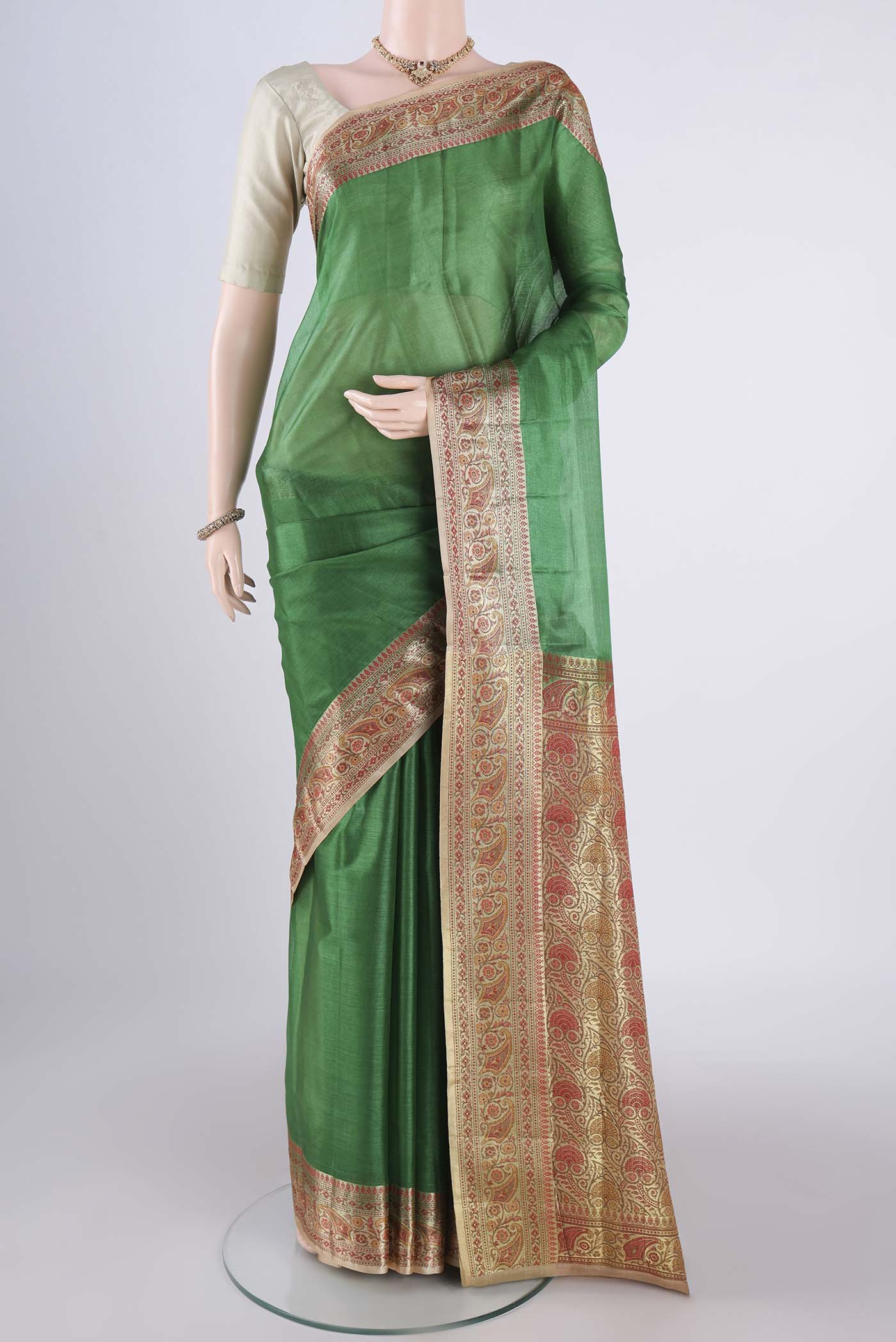 Green Dual Tone Maheshwari Silk Cotton Saree with Plain Body and Zari Border.  displayed on a mannequin