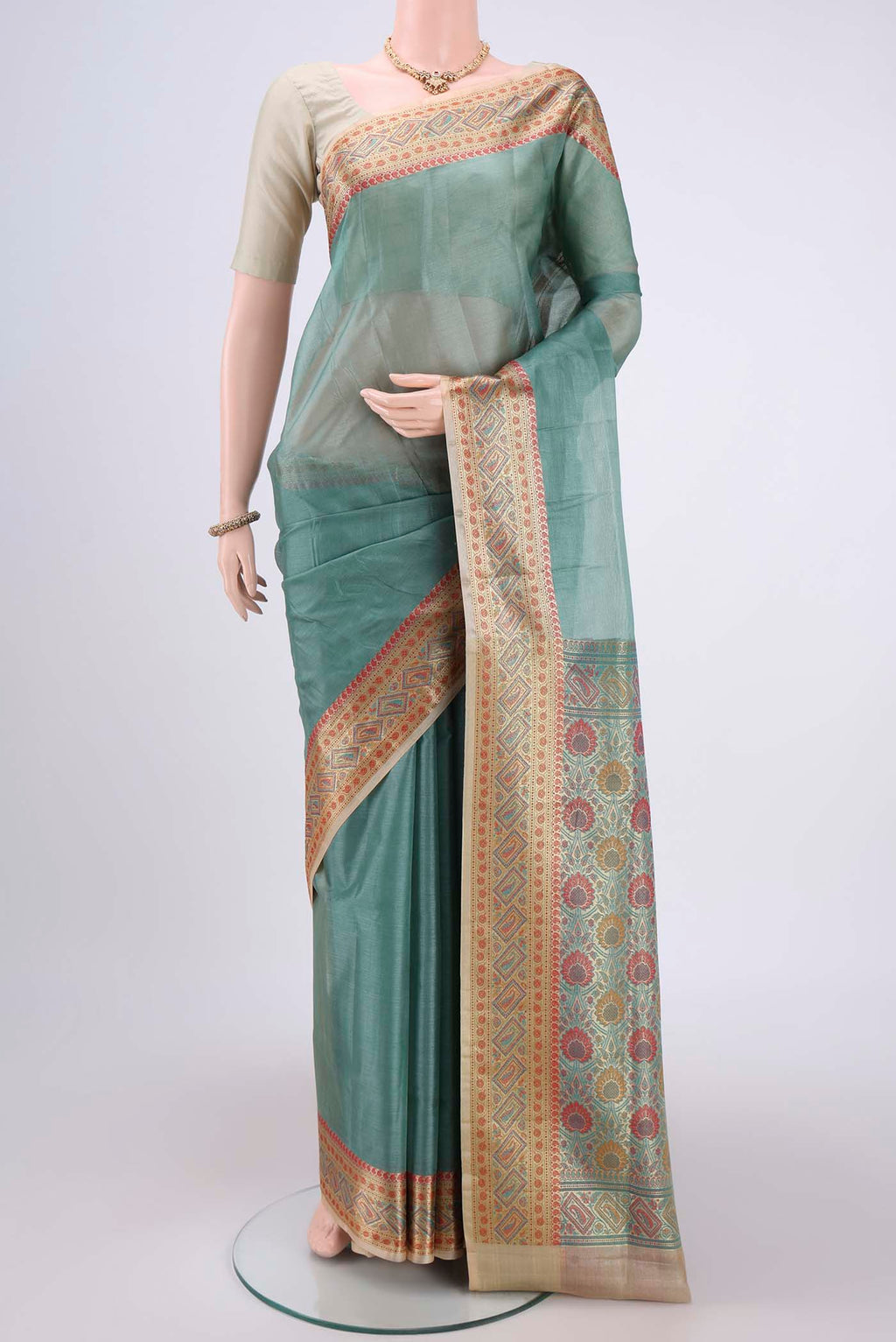Pickle Green Dual Tone Maheshwari Silk Cotton Saree with Plain Body and Zari Border.  displayed on a mannequin