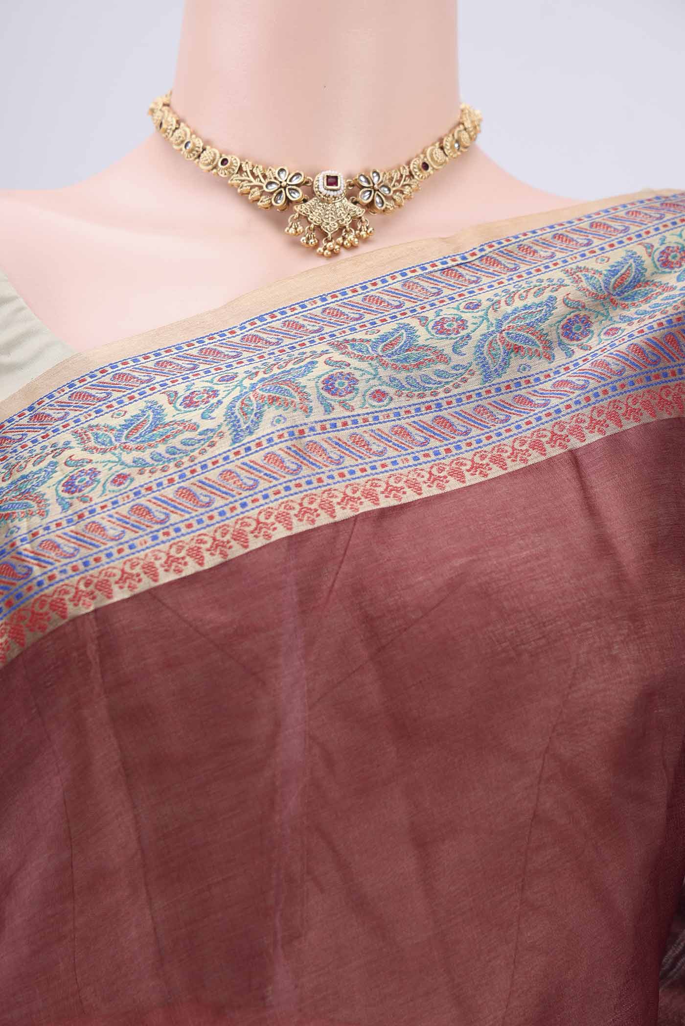 Border image of Brown Dual Tone Maheshwari Silk Cotton Saree with Plain Body and Zari Border. 