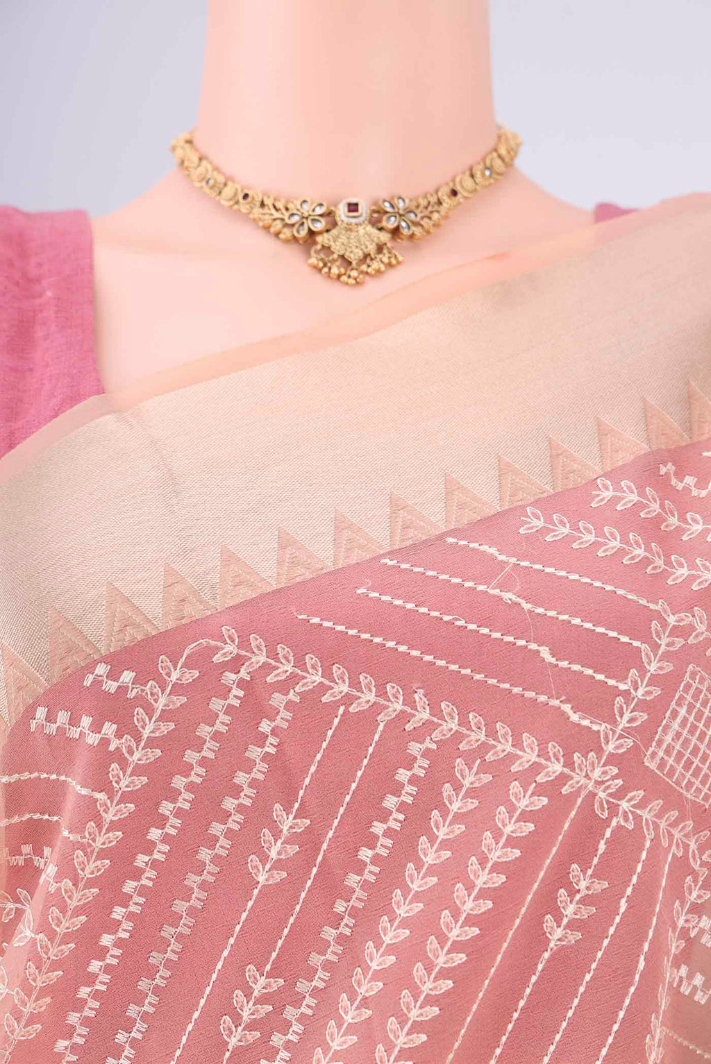 Border image of Peach Blended Kota Cotton Saree with Embroidery on the body and Zari Border. 