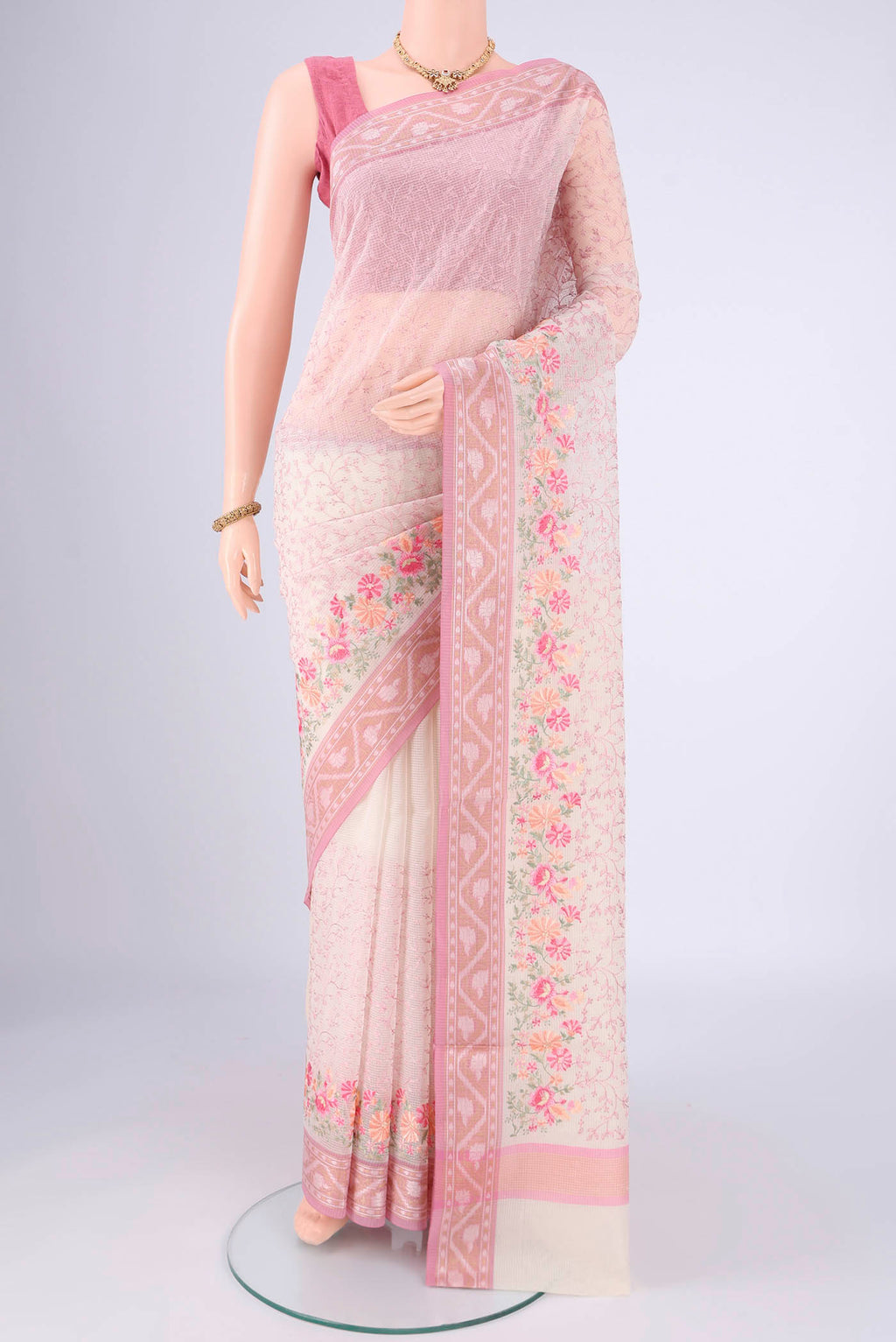 White Blended Kota Cotton Saree with Embroidery on the body and Zari Border.  displayed on a mannequin