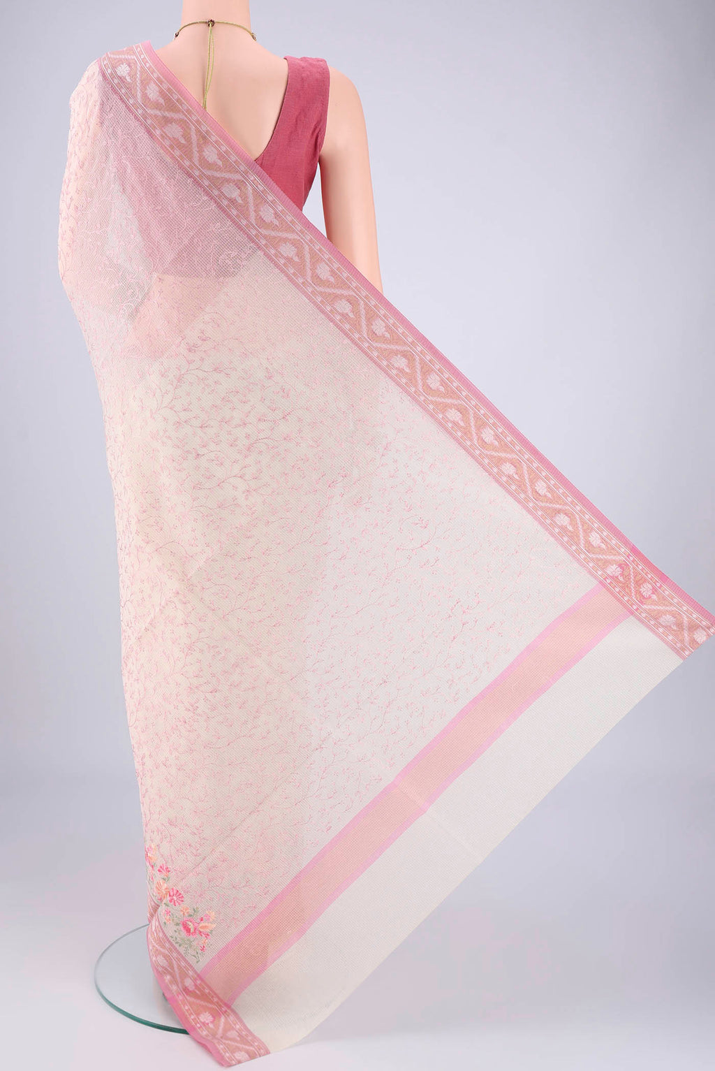 Flat view of White Blended Kota Cotton Saree with Embroidery on the body and Zari Border. 