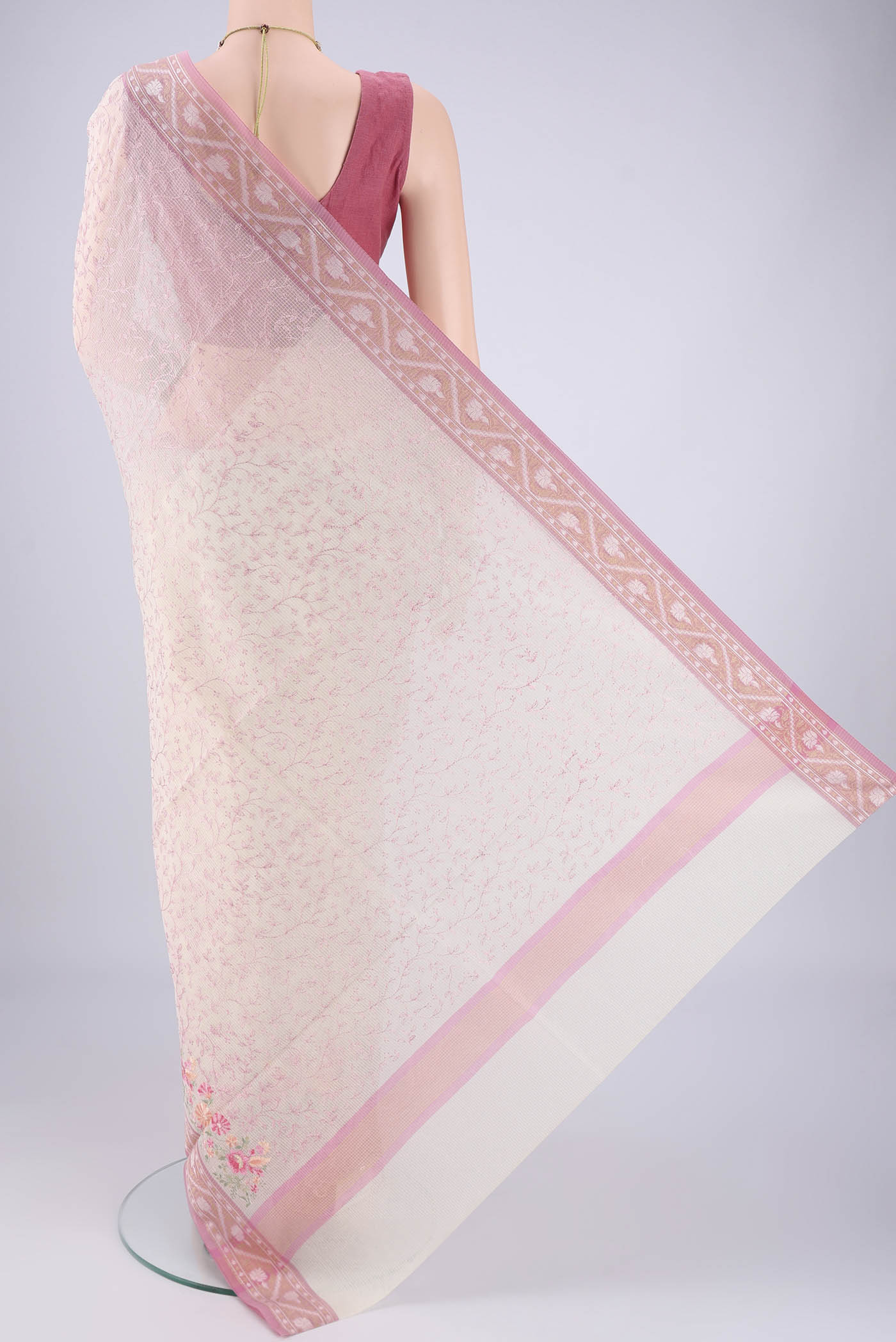 Flat view of White Blended Kota Cotton Saree with Embroidery on the body and Zari Border. 