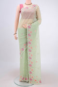 Light Green Kota Cotton Saree with Embroidery on the body and Thread Border.  displayed on a mannequin