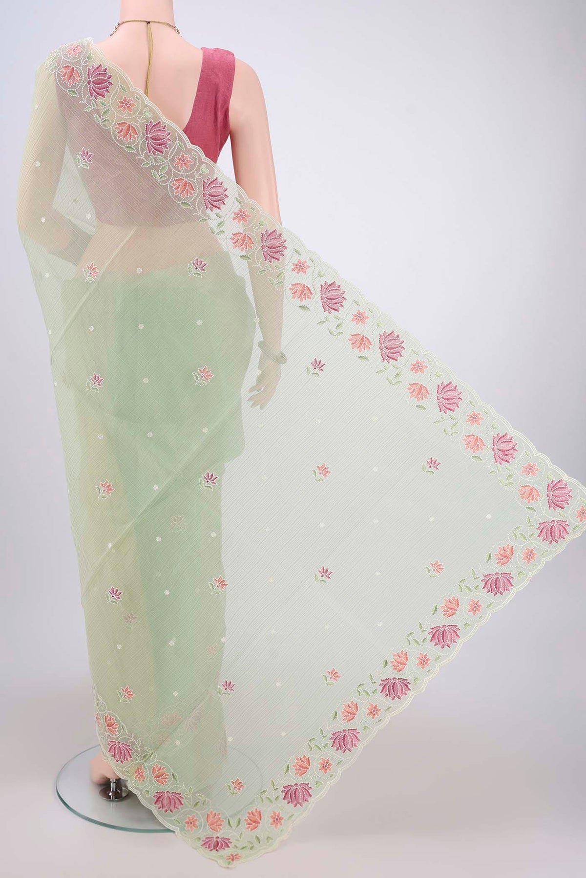 Flat view of Light Green Kota Cotton Saree with Embroidery on the body and Thread Border. 