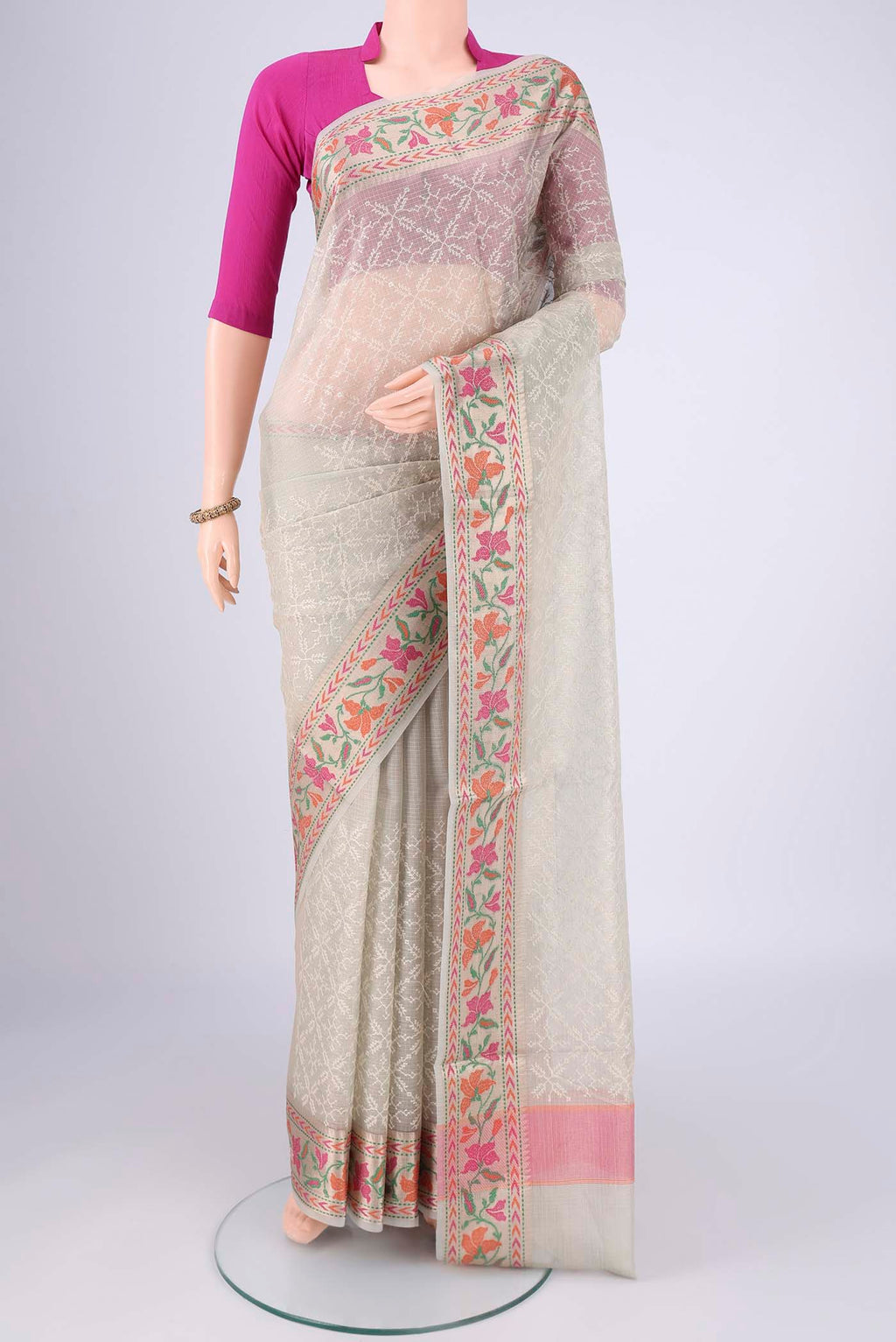 Grey Blended Kota Cotton Saree with Embroidery on the body and Thread Border.  displayed on a mannequin