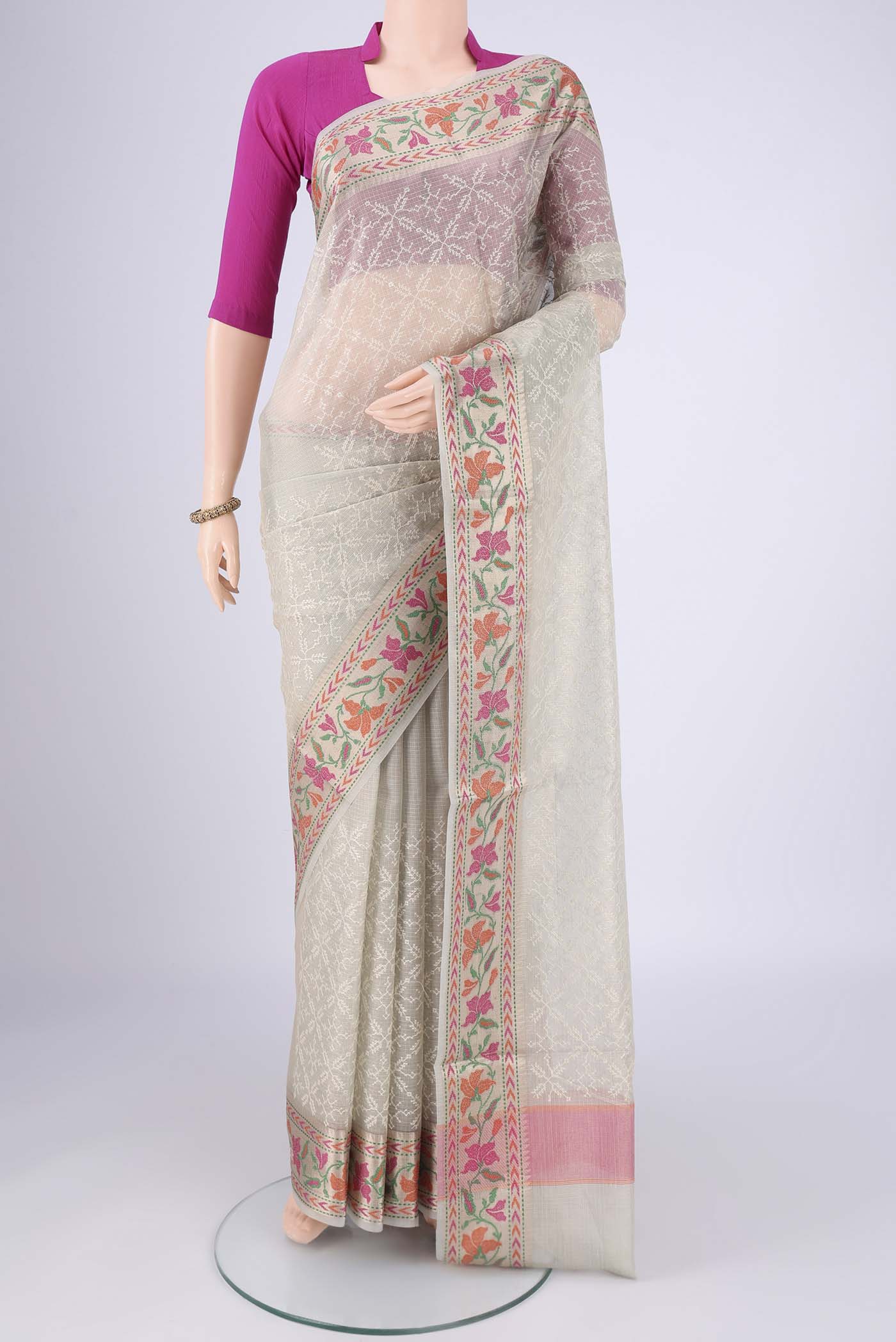 Grey Blended Kota Cotton Saree with Embroidery on the body and Thread Border.  displayed on a mannequin