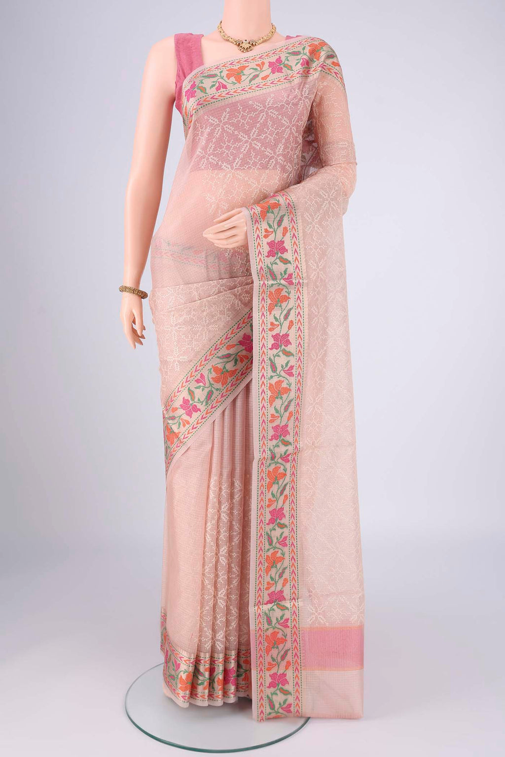 Rose pink Blended Kota Cotton Saree with Embroidery on the body and Zari And Thread Border.  displayed on a mannequin