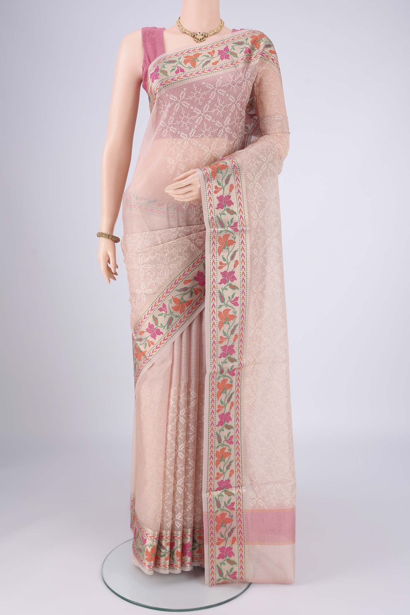 Rose pink Blended Kota Cotton Saree with Embroidery on the body and Zari And Thread Border.  displayed on a mannequin