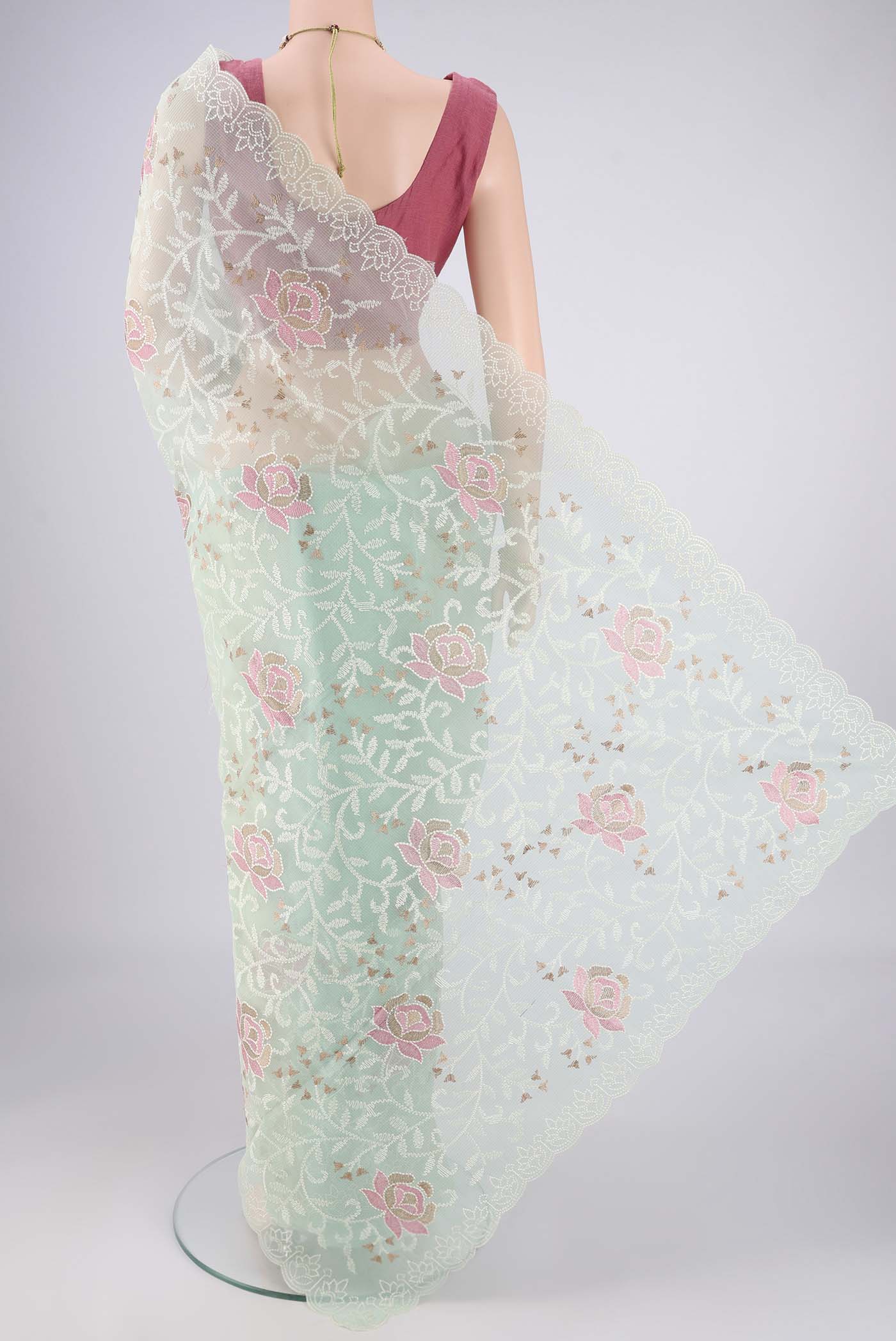 Flat view of Mint Green Blended Kota Cotton Saree with Embroidery on the body and Thread Border. 