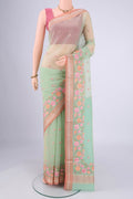 Mint Green Blended Kota Cotton Saree with Embroidery on the body and Zari Border.  displayed on a mannequin