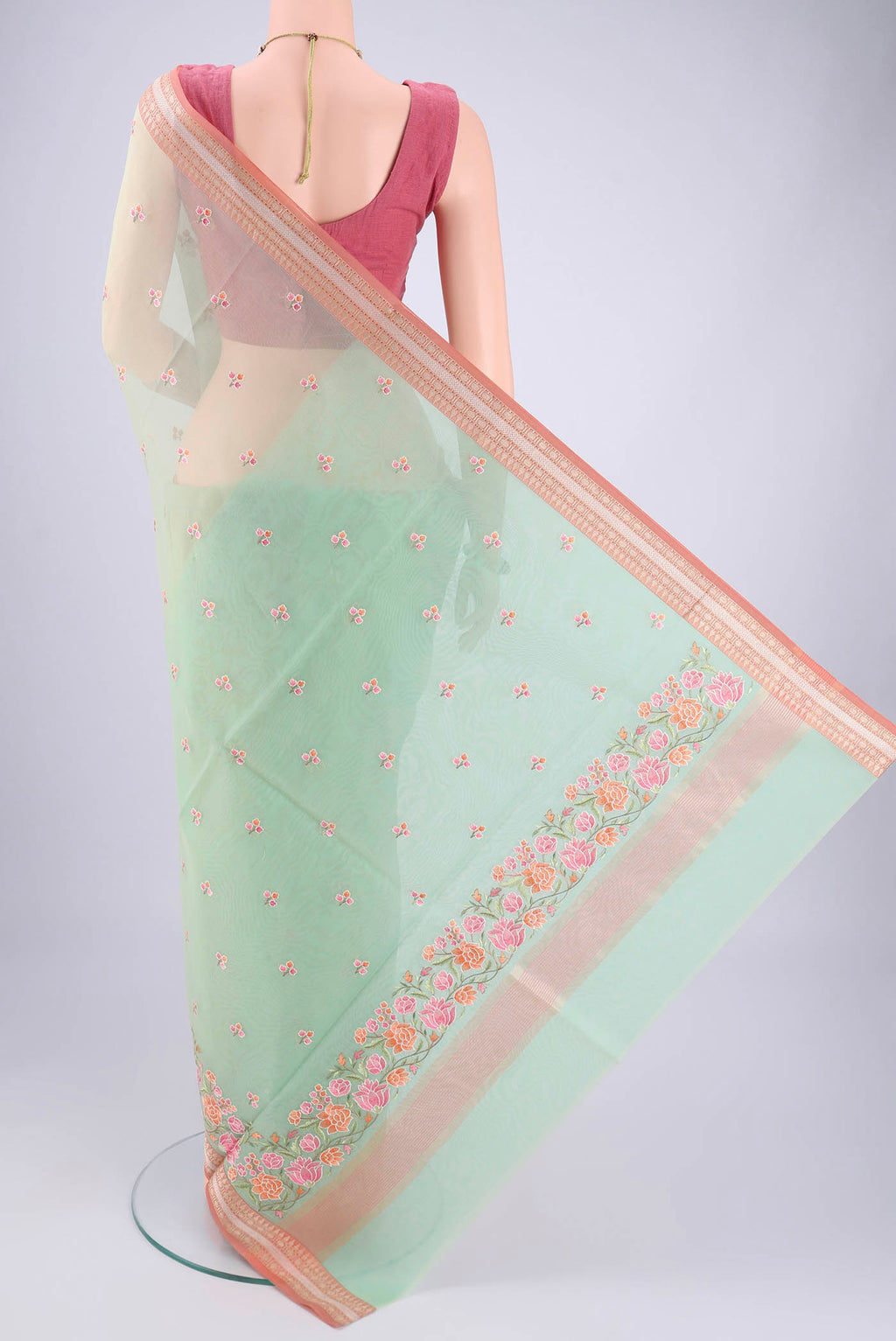 Flat view of Mint Green Blended Kota Cotton Saree with Embroidery on the body and Zari Border. 