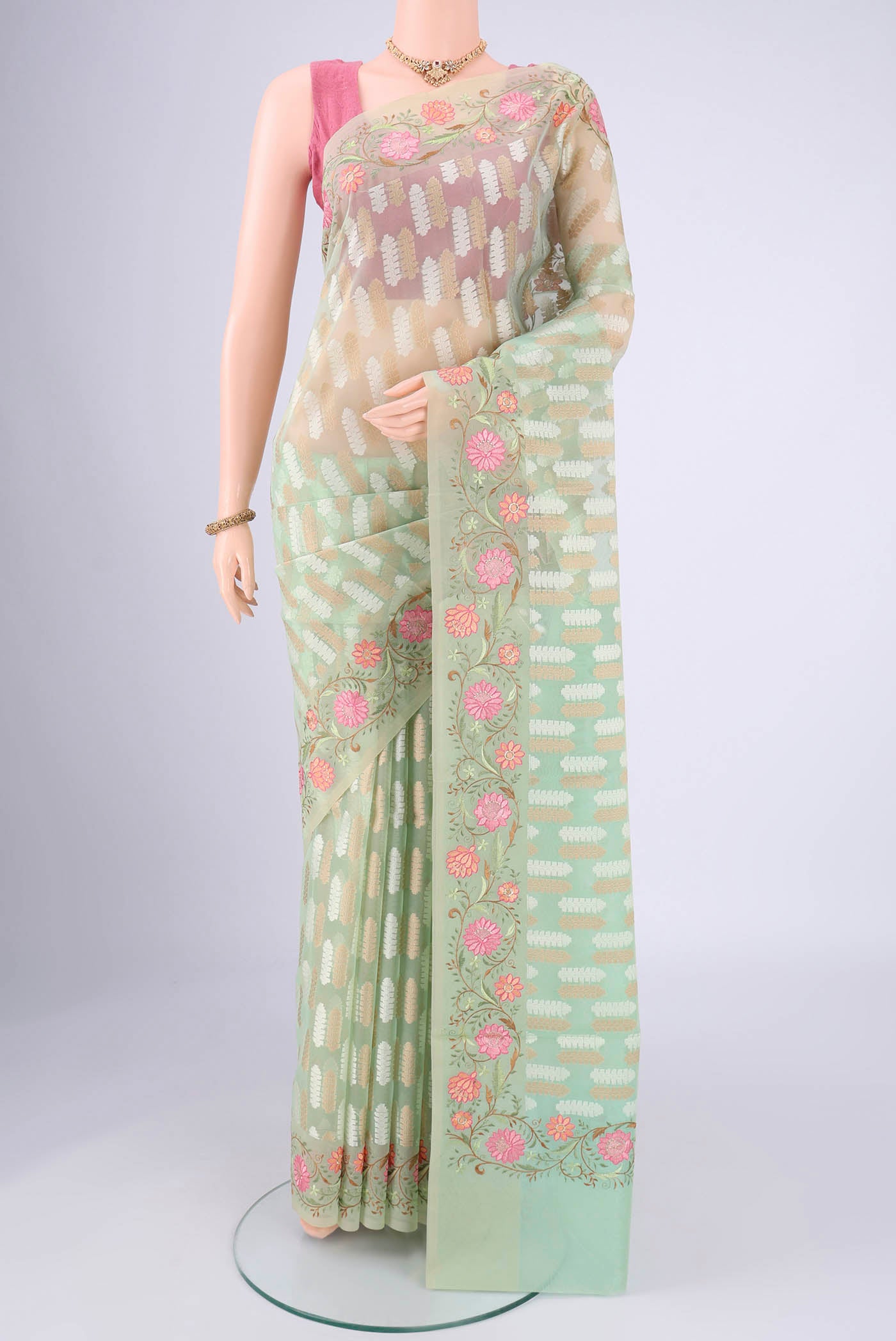 Mint Green Blended Kota Cotton Saree with Embroidery on the body and Thread Border.  displayed on a mannequin