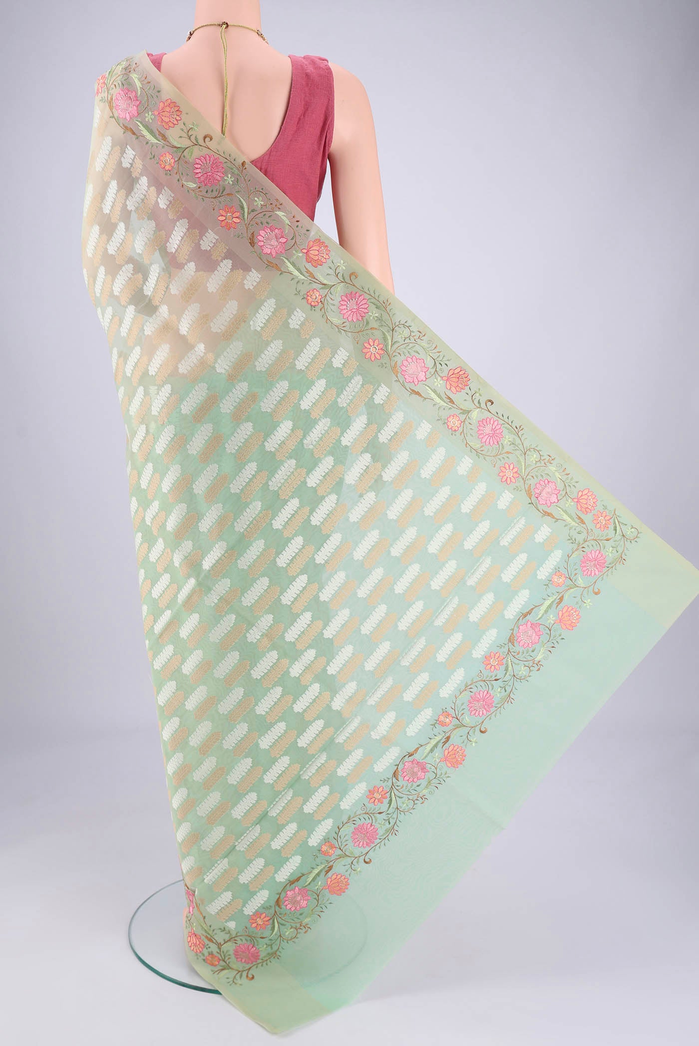 Flat view of Mint Green Blended Kota Cotton Saree with Embroidery on the body and Thread Border. 