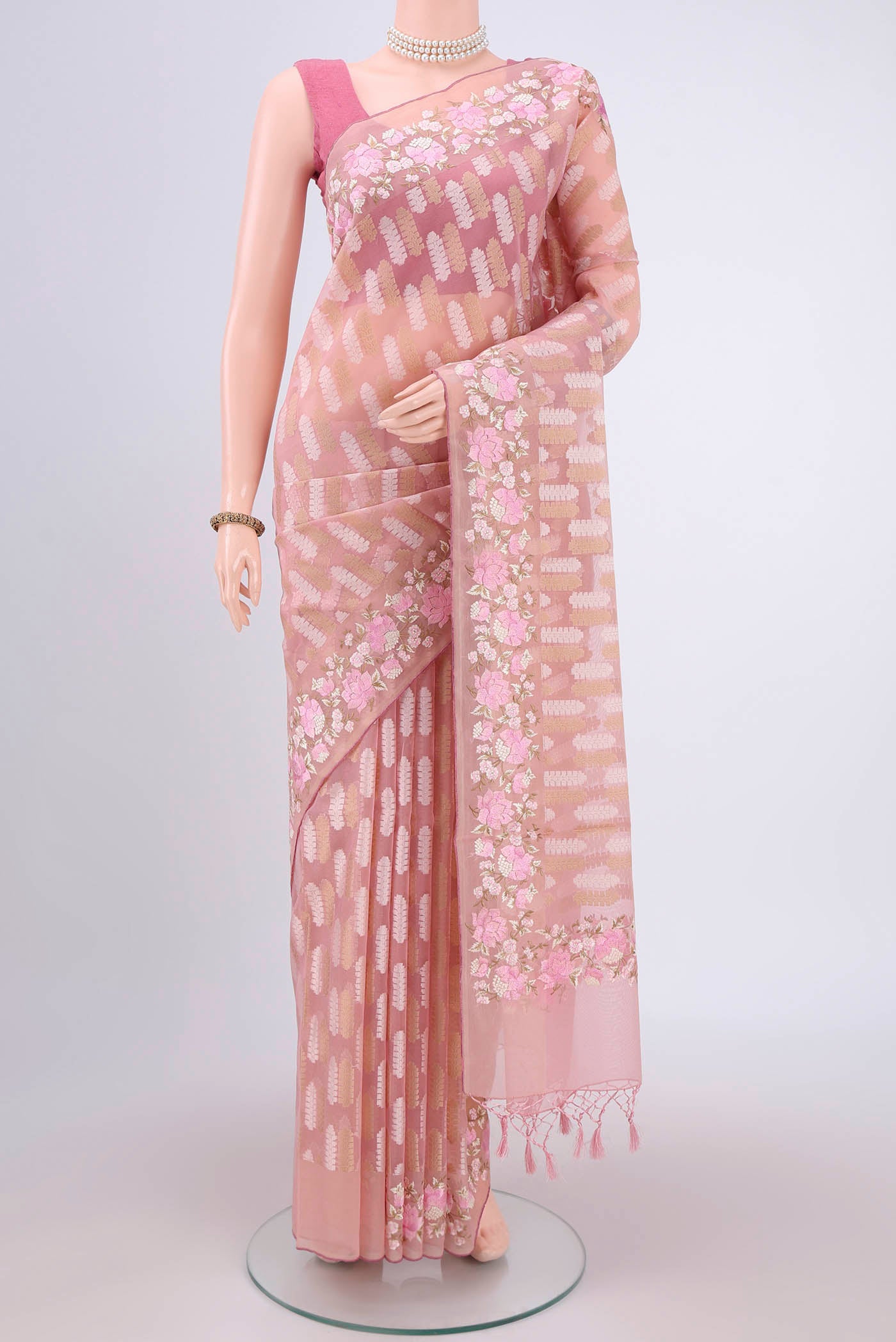 Pink Kota Cotton Saree with Embroidery on the body and Zari Border.  displayed on a mannequin