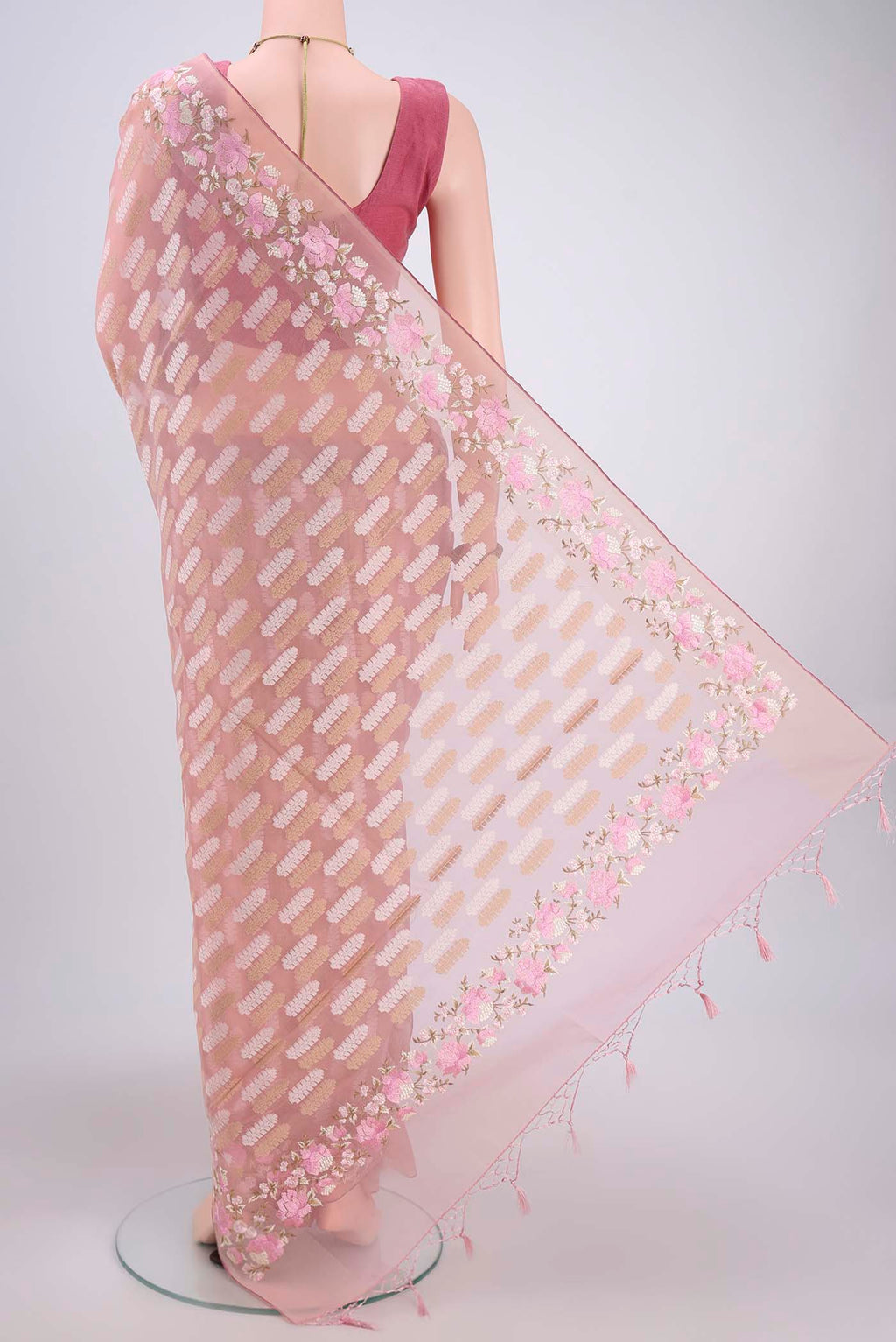 Flat view of Pink Kota Cotton Saree with Embroidery on the body and Zari Border. 