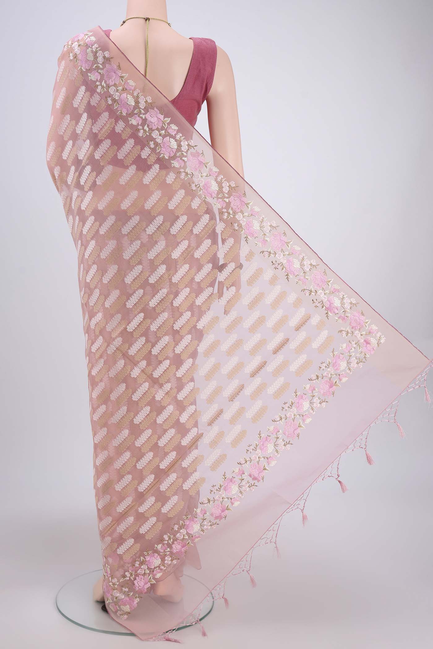 Flat view of Pink Kota Cotton Saree with Embroidery on the body and Zari Border. 