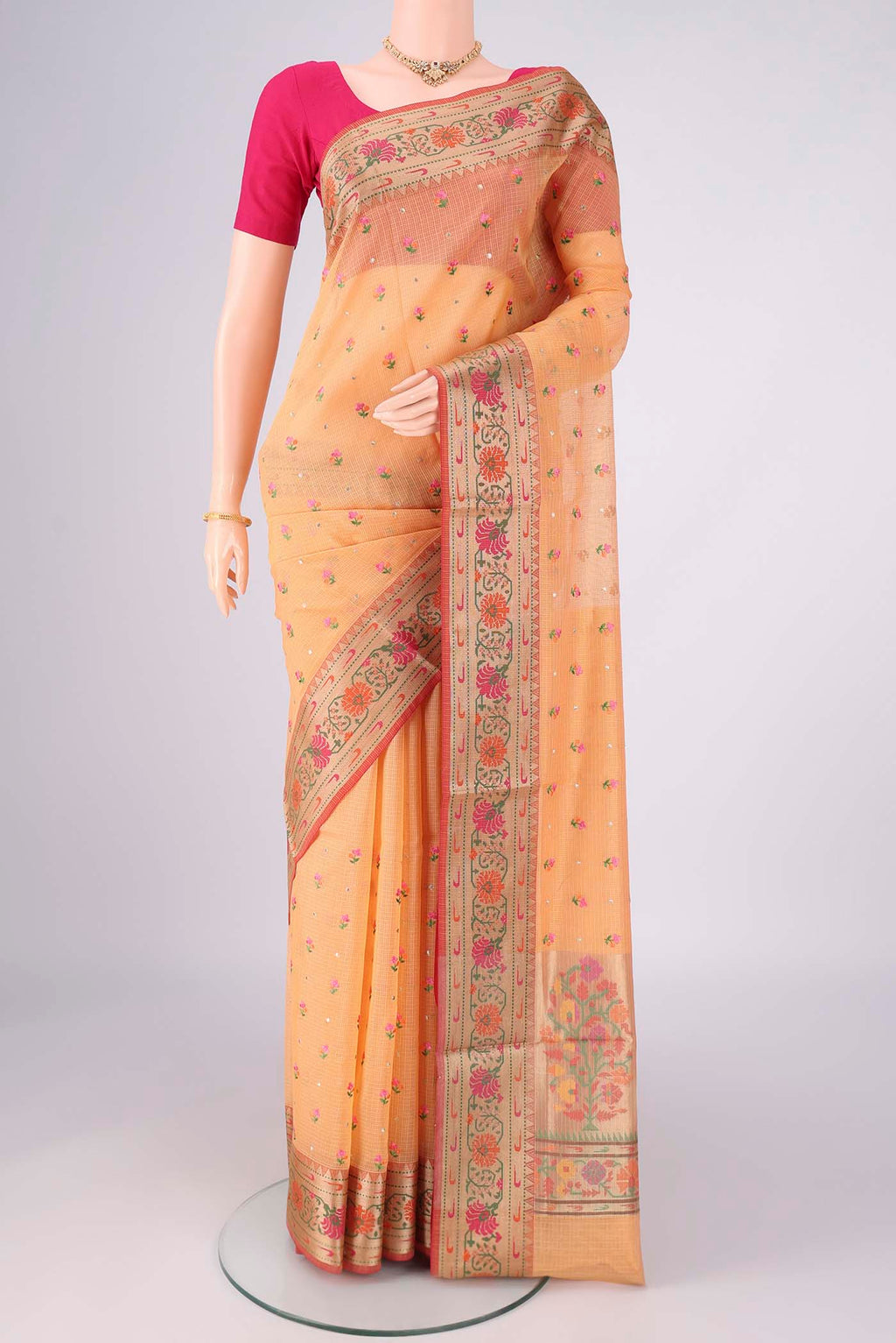 Orange Blended Kota Cotton Saree with Embroidery on the body and Zari Border.  displayed on a mannequin