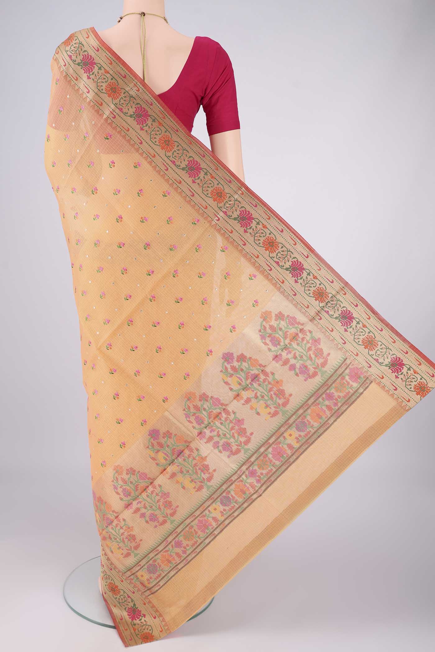 Flat view of Orange Blended Kota Cotton Saree with Embroidery on the body and Zari Border. 
