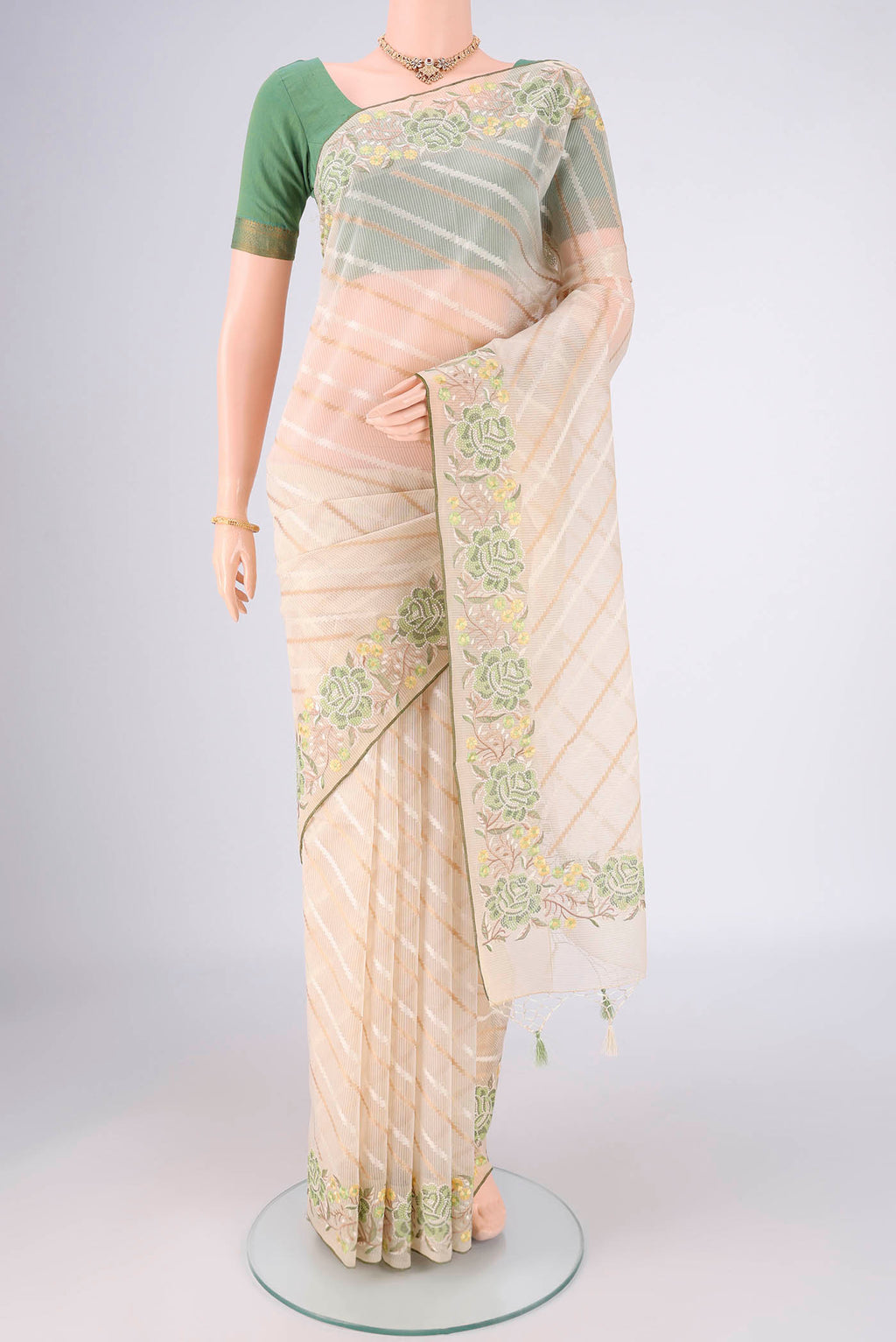 Cream Blended Kota Cotton Saree with Stripes on the body and Embroidery Border.  displayed on a mannequin