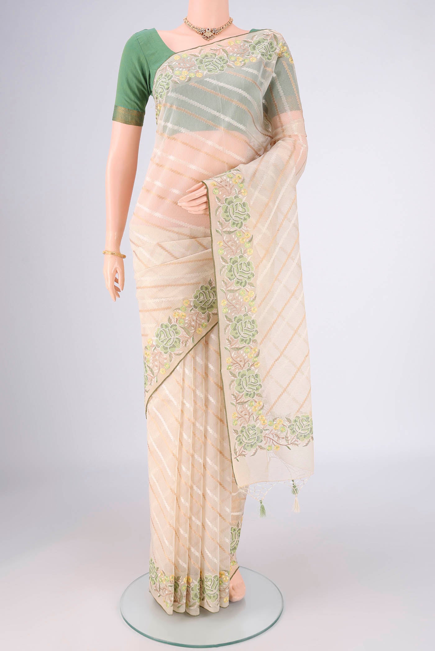 Cream Blended Kota Cotton Saree with Stripes on the body and Embroidery Border.  displayed on a mannequin
